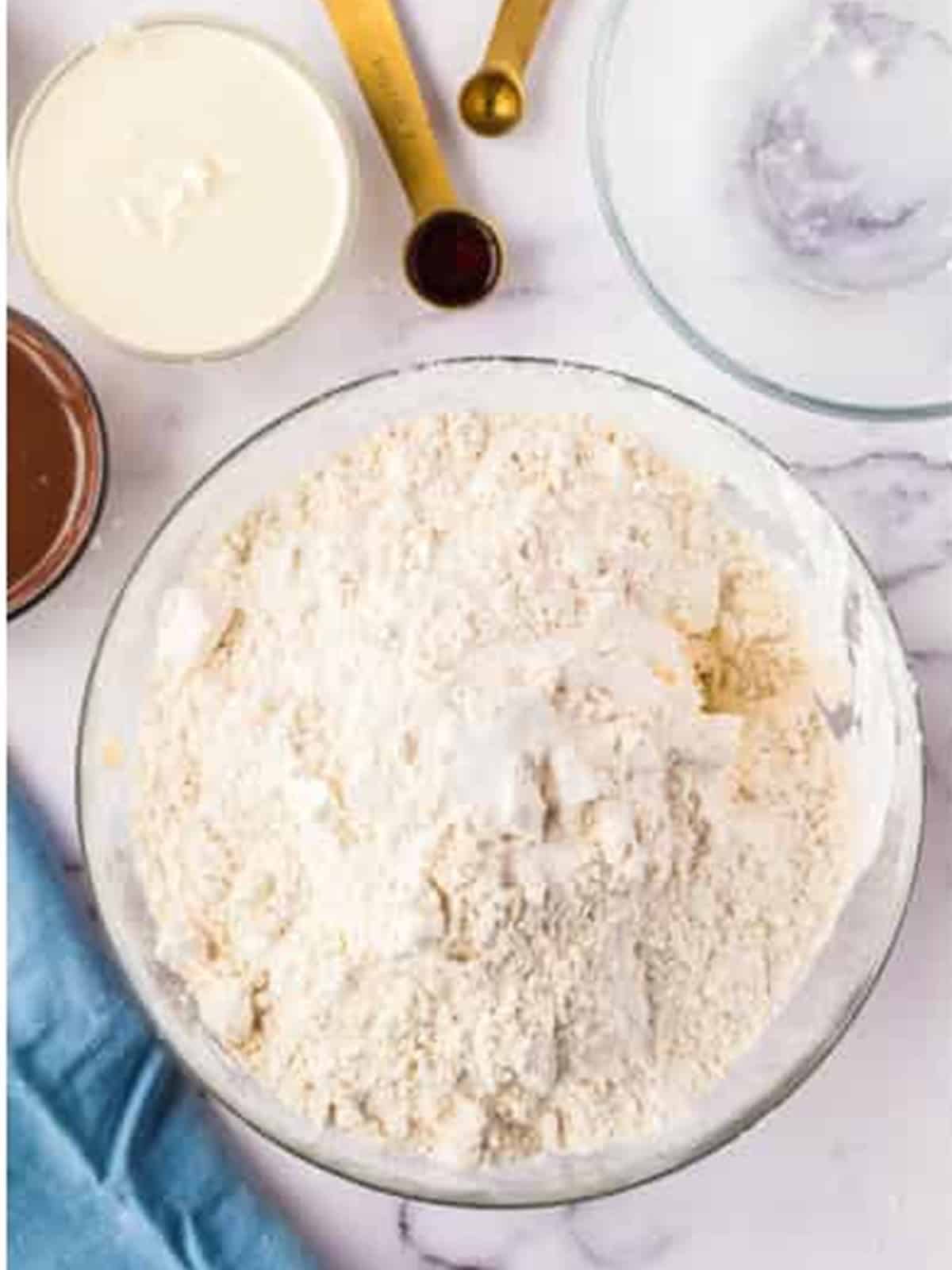Butter, sugar, and flour creamed in a bowl for shortbread