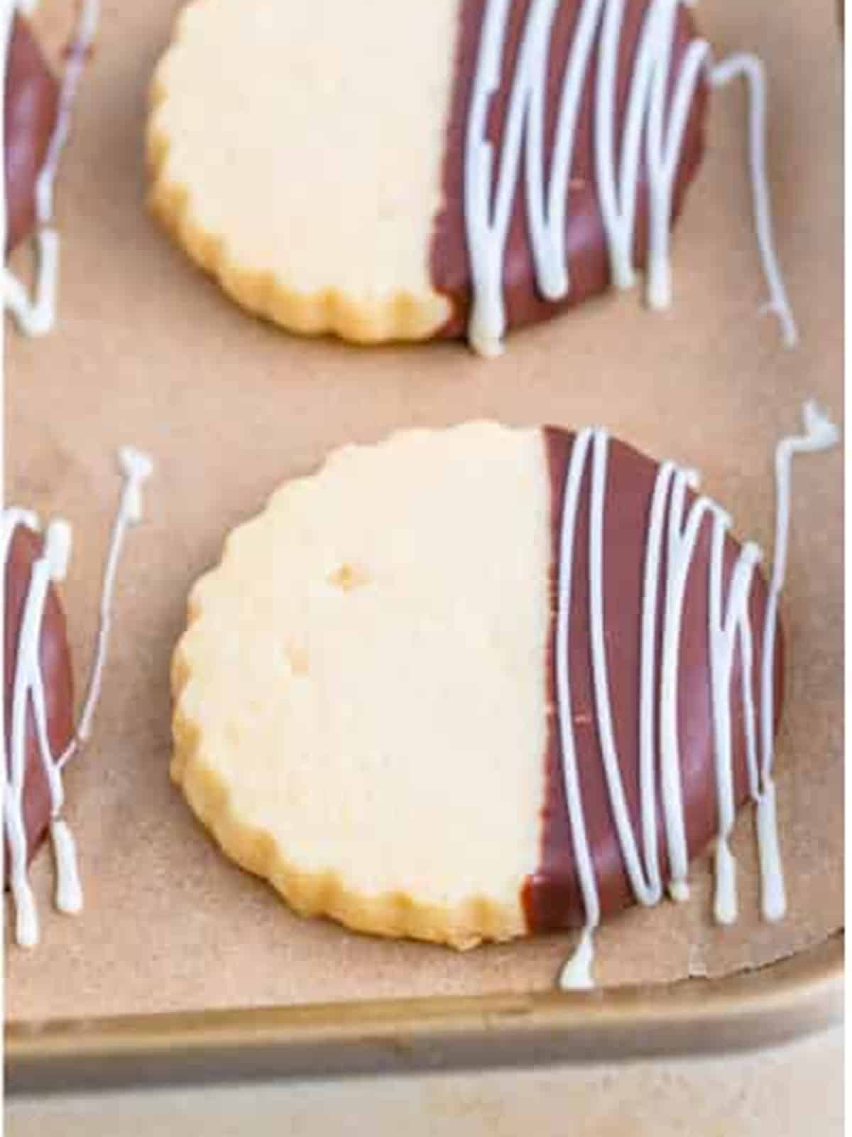 Chocolate dipped shortbread cookies drizzled with white chocolate