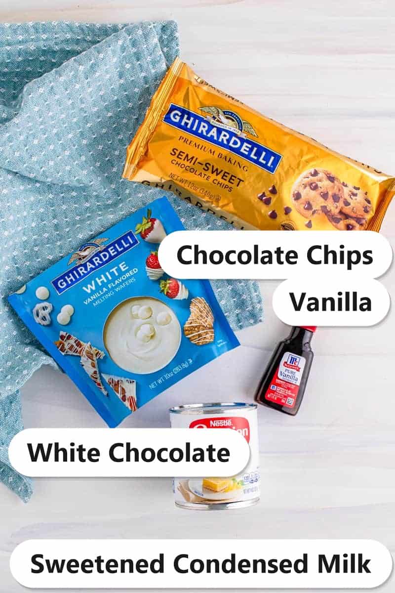 Labeled ingredients for chocolate fudge including semi-sweet chocolate chips, white chocolate wafers, vanilla, and sweetened condensed milk.