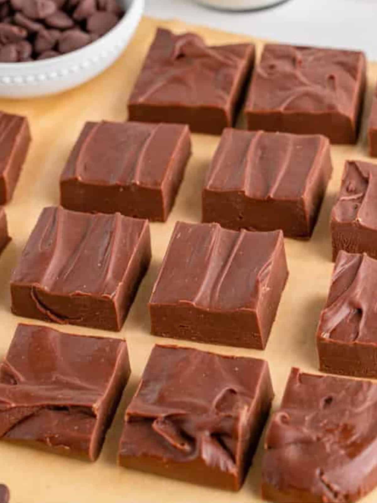 Cut squares of chocolate fudge drizzled with white chocolate.
