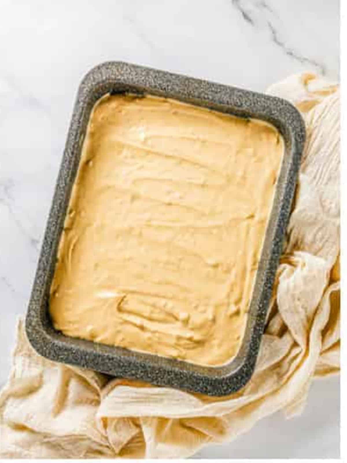 Cream cheese filling spread over the chocolate cookie crust.