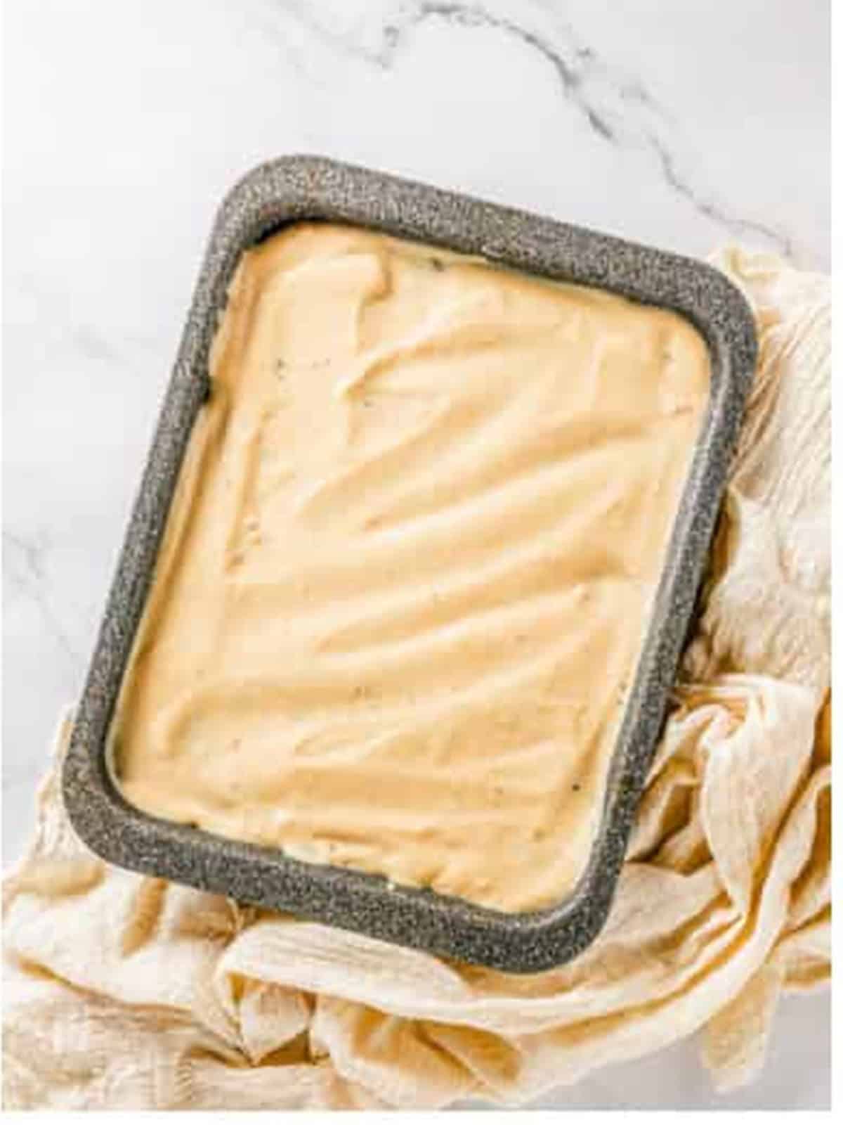 Peanut butter pudding spread smoothly over the layers of chocolate lasagna.