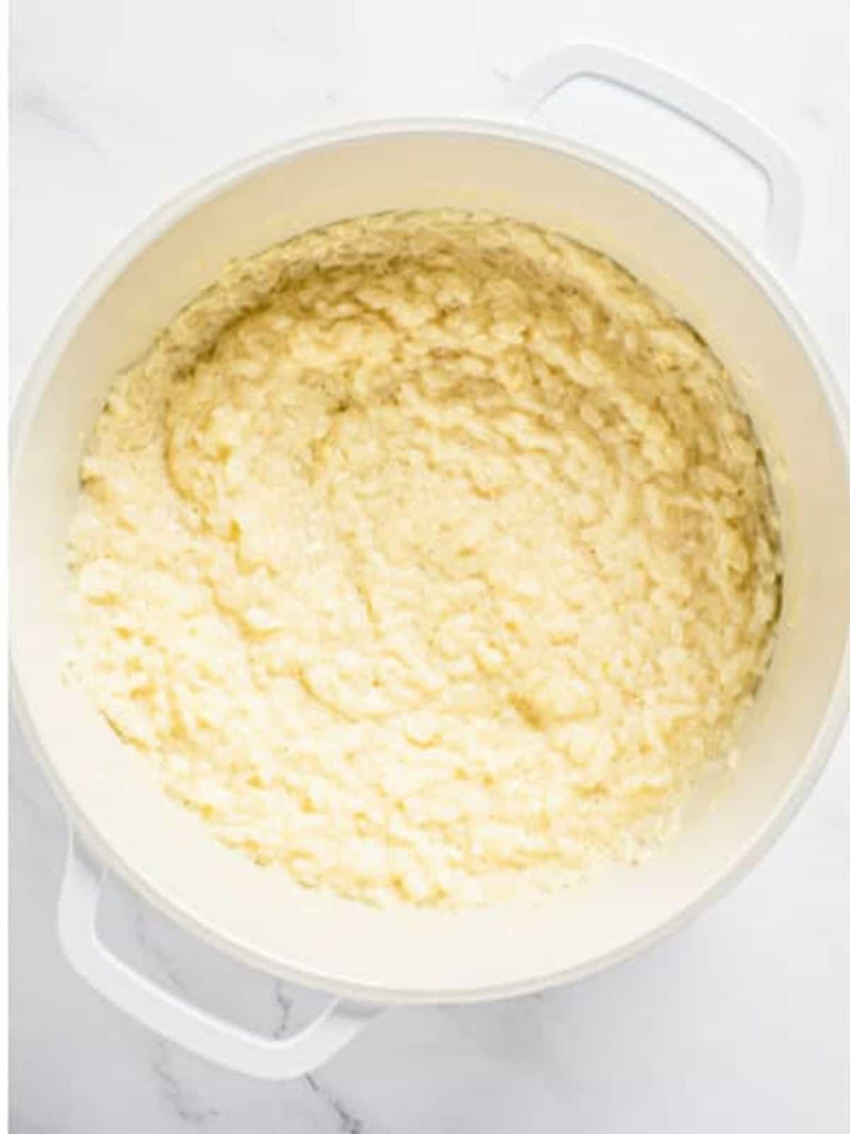 Thickened creamy rice pudding in a pot.