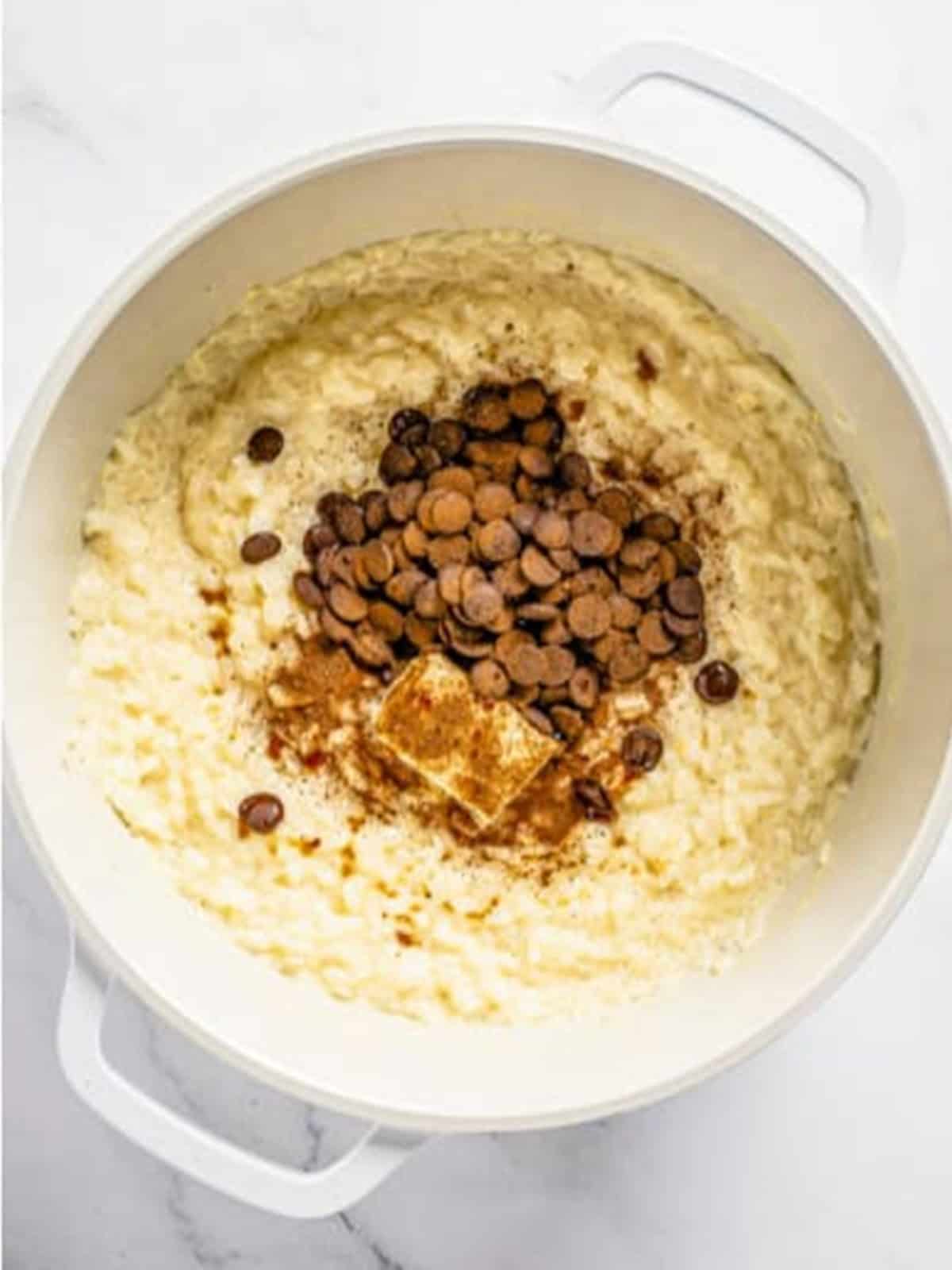 Chocolate chips, butter, and cinnamon added to rice pudding.