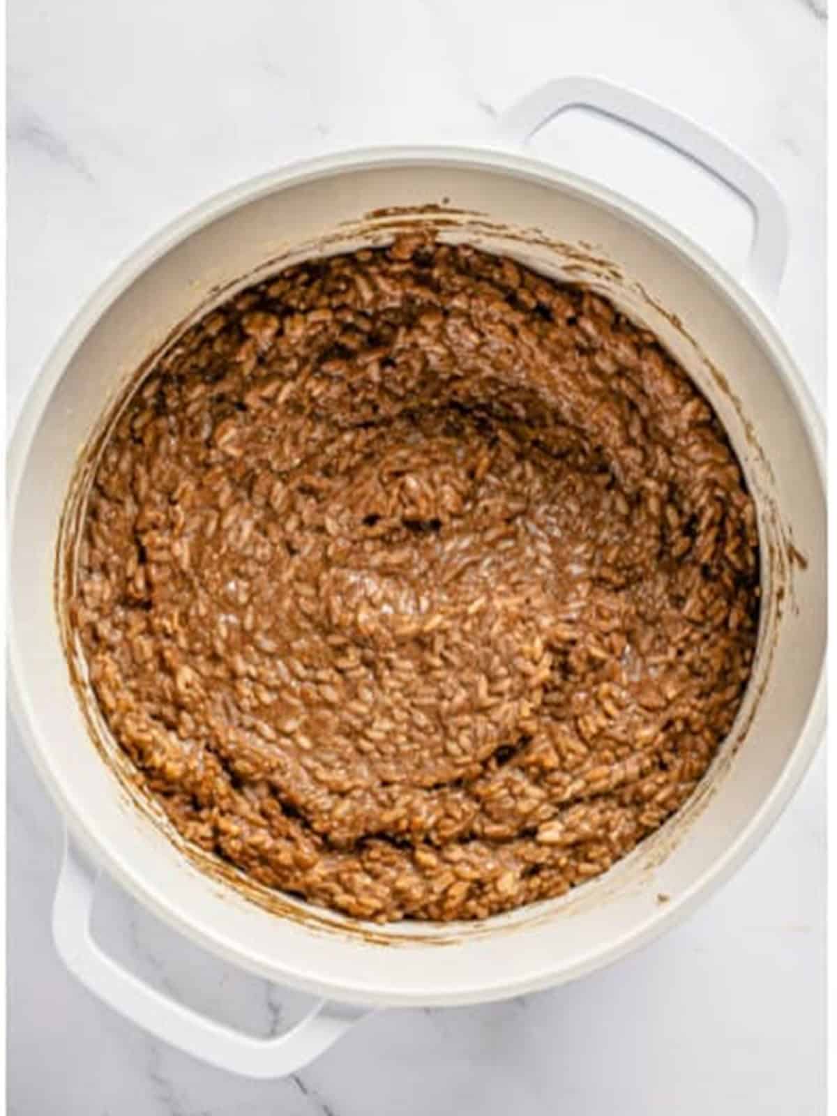 Finished chocolate rice pudding stirred smooth in a pot.