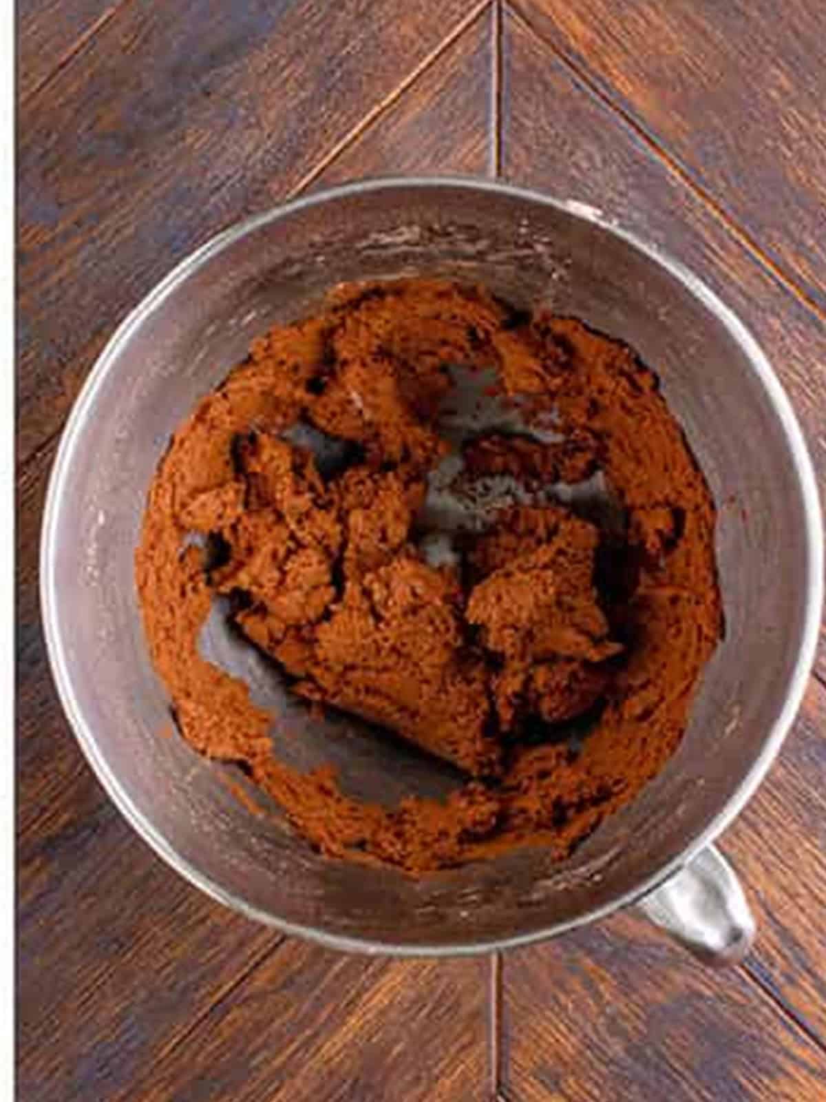 Soft chocolate sugar cookie dough mixed in a bowl.