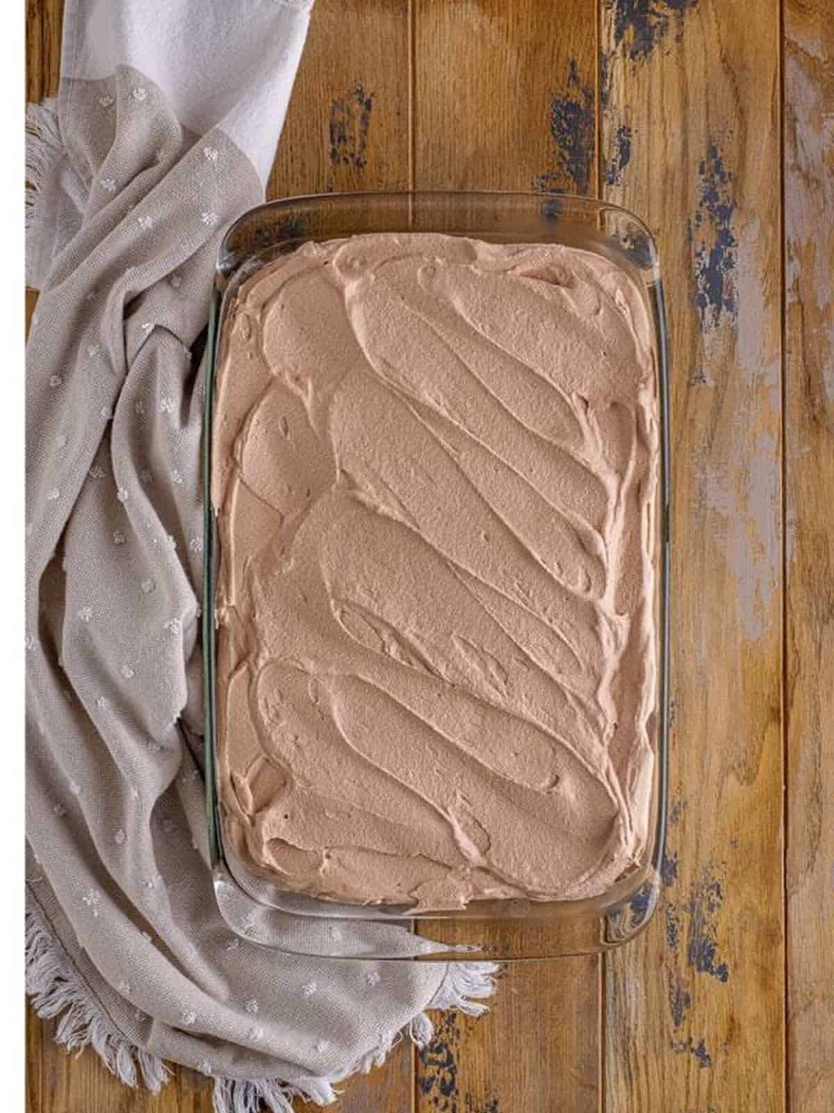 Chocolate tres leches cake frosted with chocolate whipped cream.