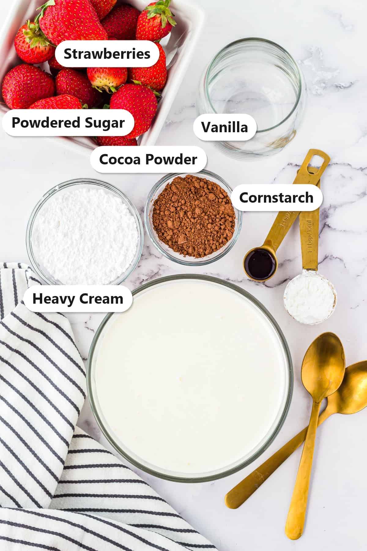 Heavy cream, powdered sugar, cocoa powder, cornstarch, vanilla, and strawberries labeled for Chocolate Whipped Cream.
