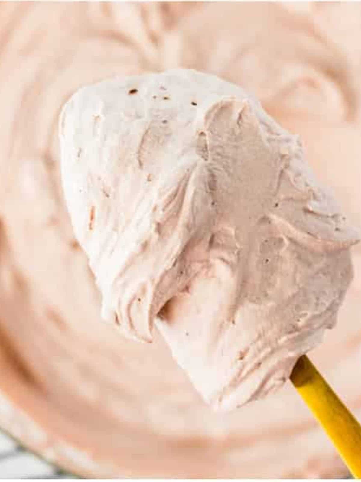 Stabilized Chocolate Whipped Cream whipped to stiff peaks on a whisk.