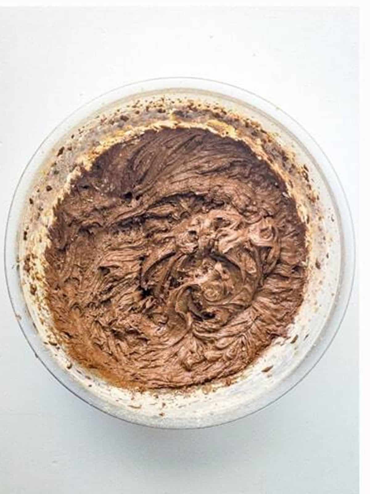Smooth chocolate whoopie pie batter mixed in a bowl.