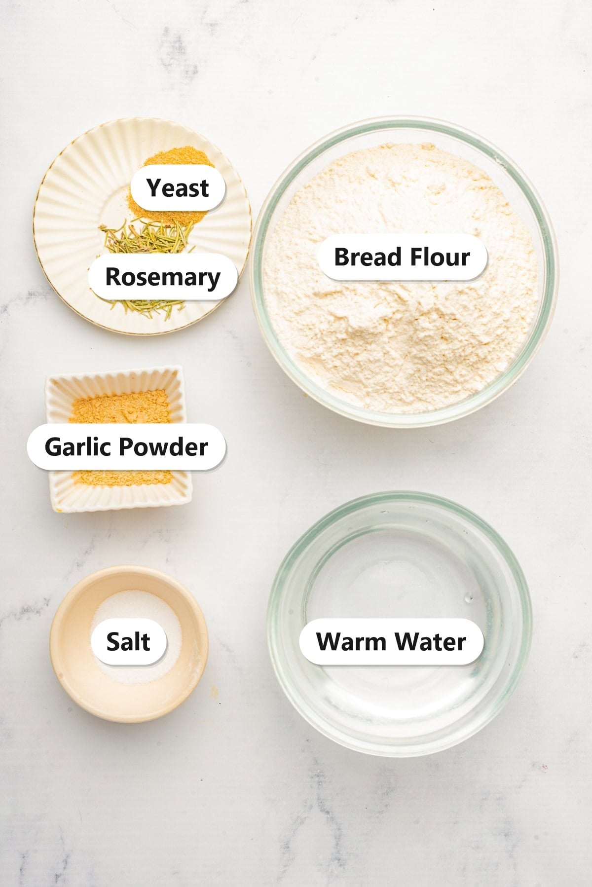 Ciabatta bread ingredients labeled on a marble counter