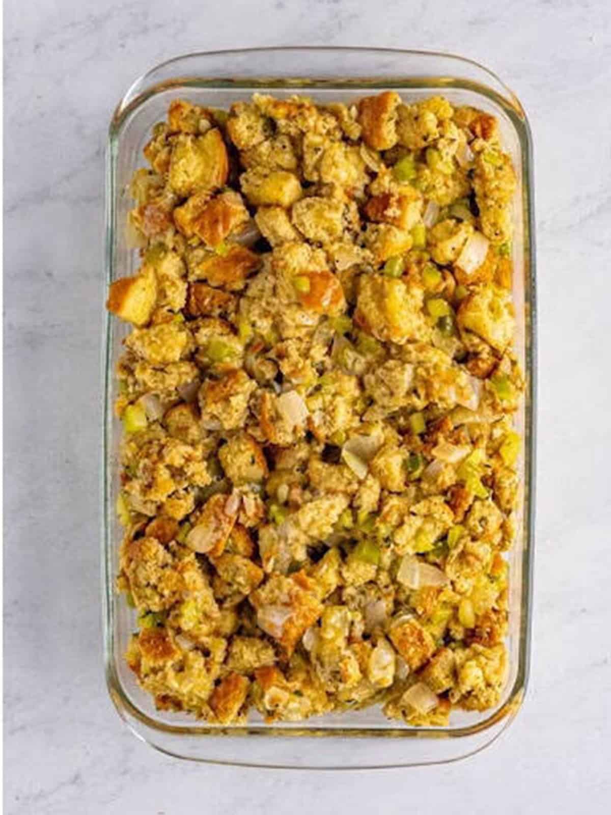Moist classic stuffing pressed into a baking dish and drizzled with butter before baking.