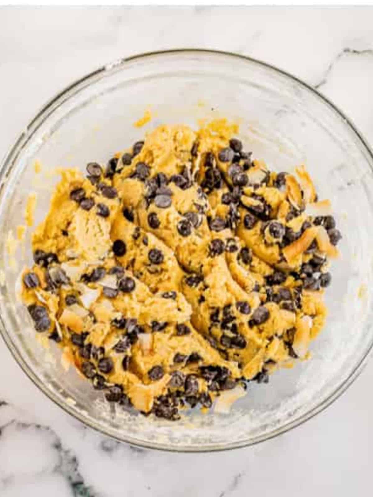 Chocolate chips and toasted coconut folded into the cookie dough.