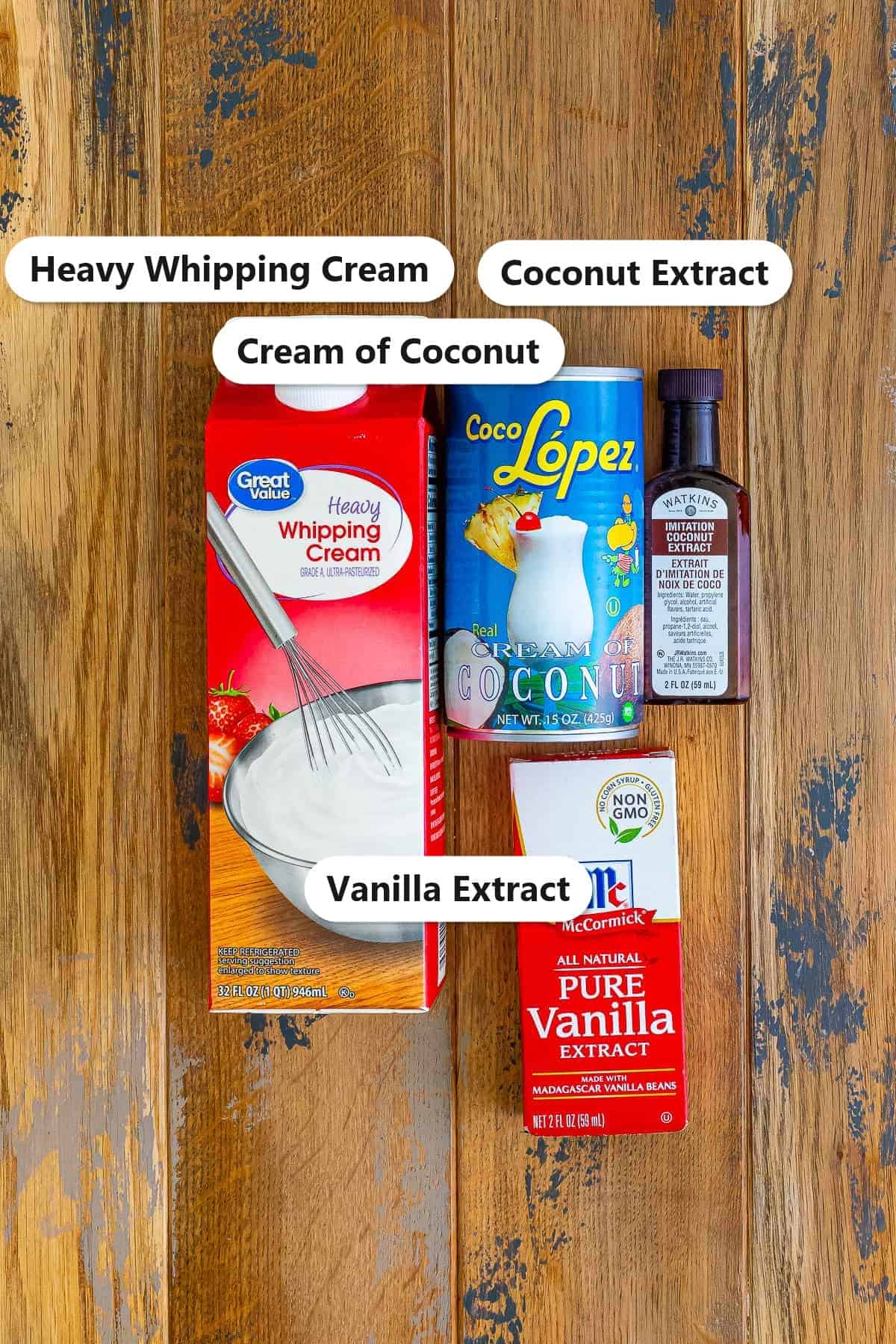 Heavy whipping cream, cream of coconut, coconut extract, and vanilla extract labeled for Coconut Ice Cream.