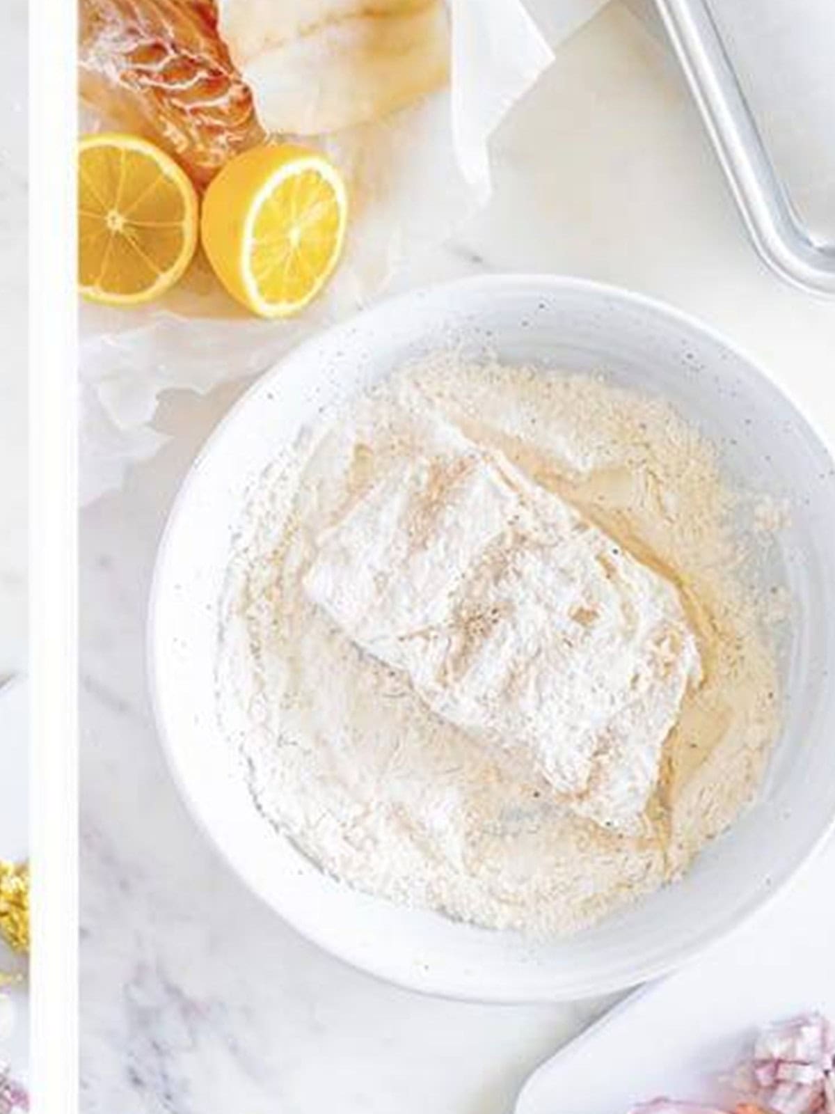 Cod fillet dredged in seasoned flour for cod piccata.