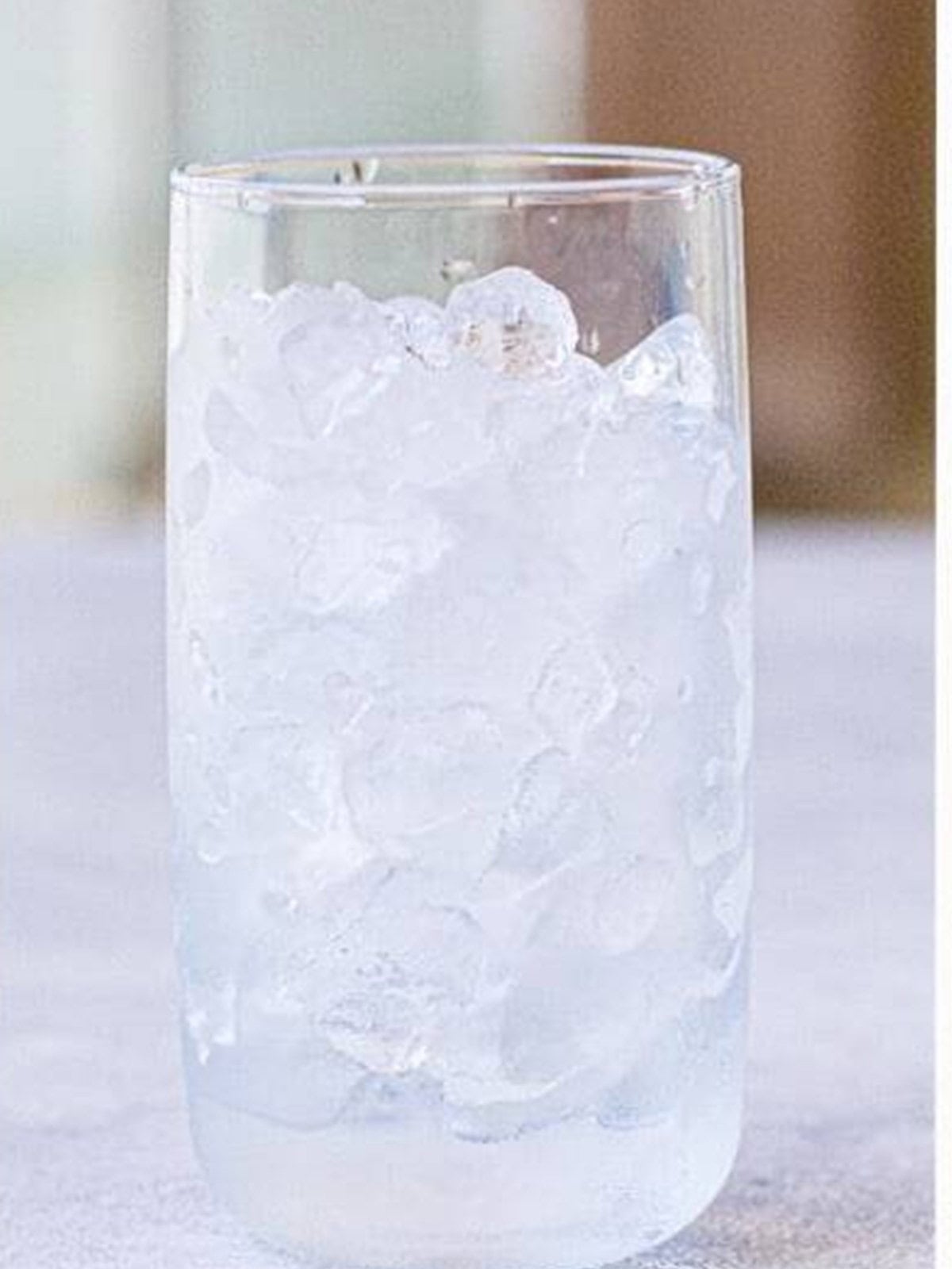 A tall glass filled with ice ready for cold brew.