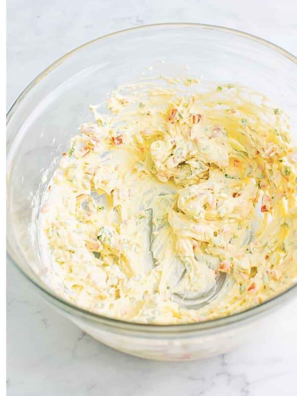 Cold crab dip base mixed smooth with an electric hand mixer.