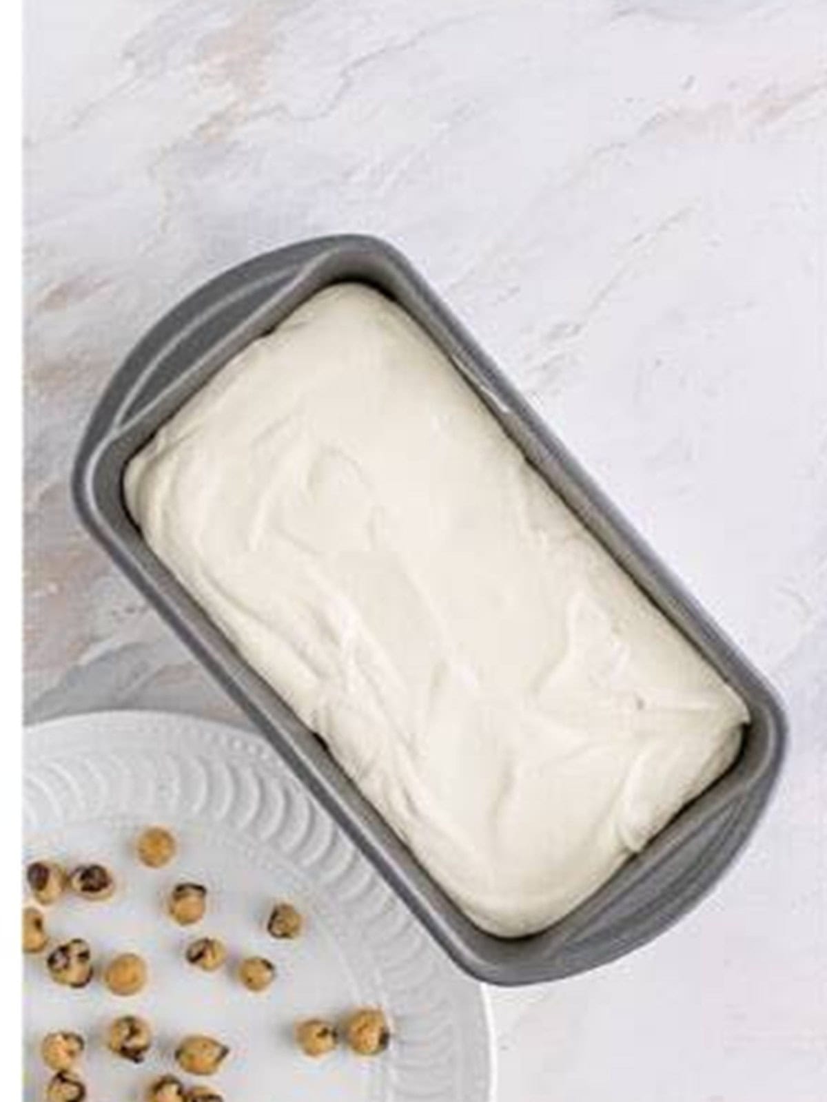 The no churn ice cream base layered into a loaf pan.