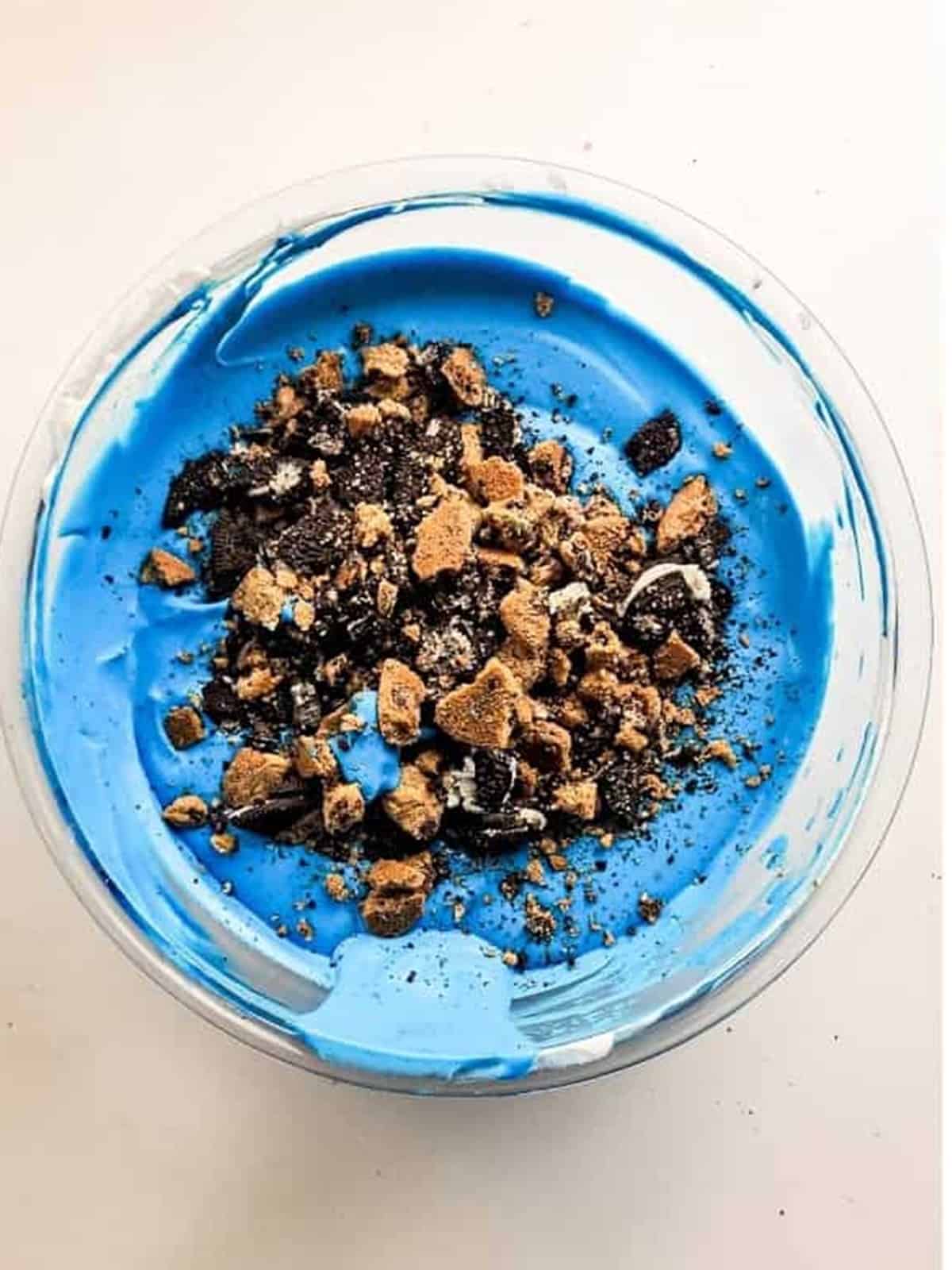 Chopped Oreos and Chips Ahoy cookies folded into the bright blue cookie monster ice cream base.