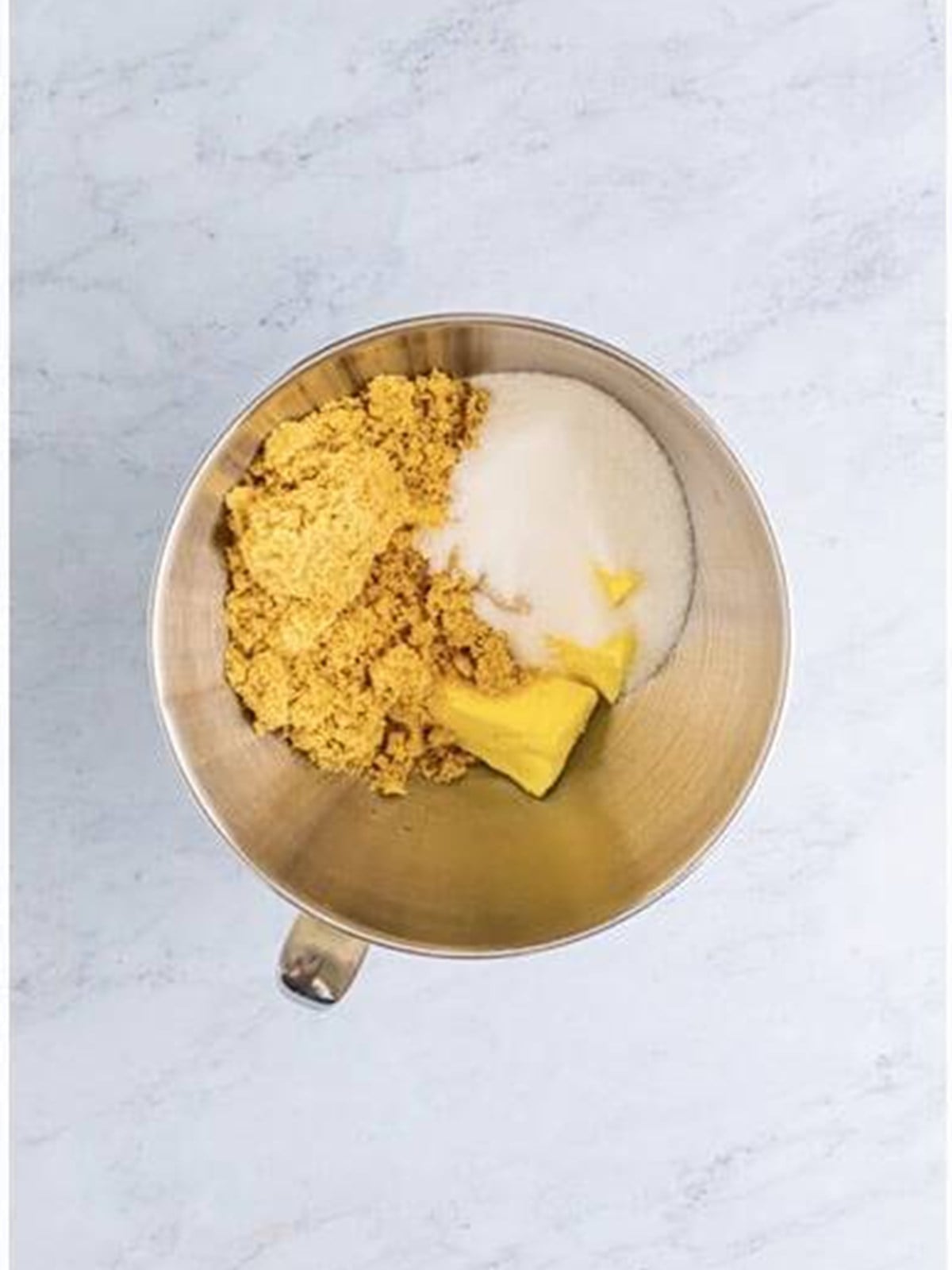 Butter, sugar, and the cocoa dry ingredients in a stand mixer bowl to start the cookie dough.