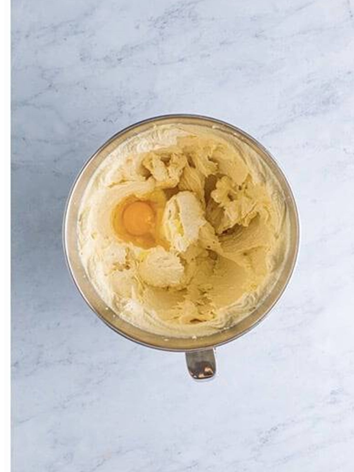 Eggs and vanilla beaten into the creamed butter and sugar.