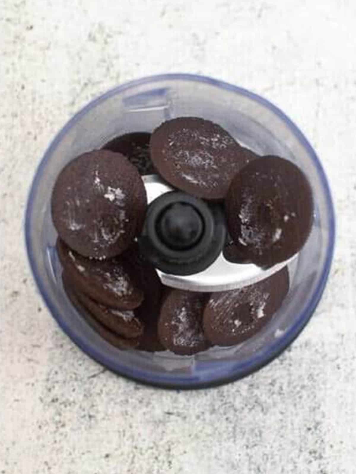 De-filled chocolate sandwich cookies in a food processor.