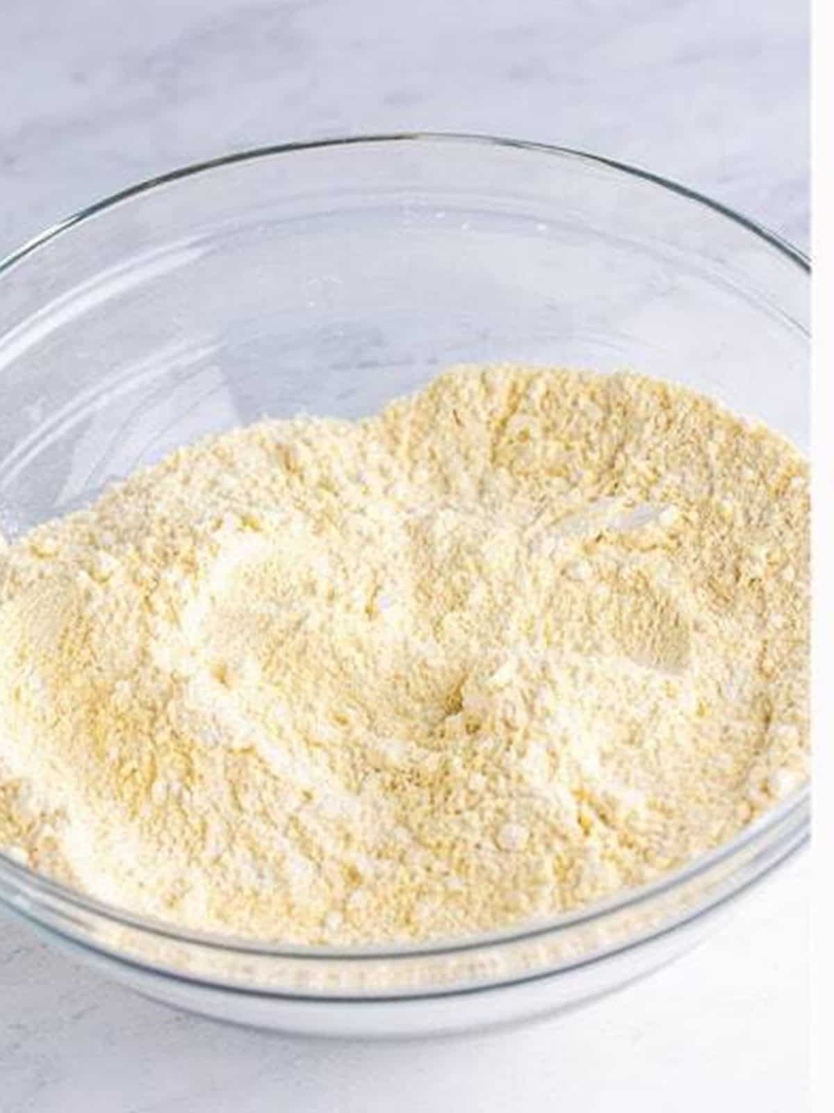 Cornmeal, flour, and seasonings whisked together for corn dog batter.