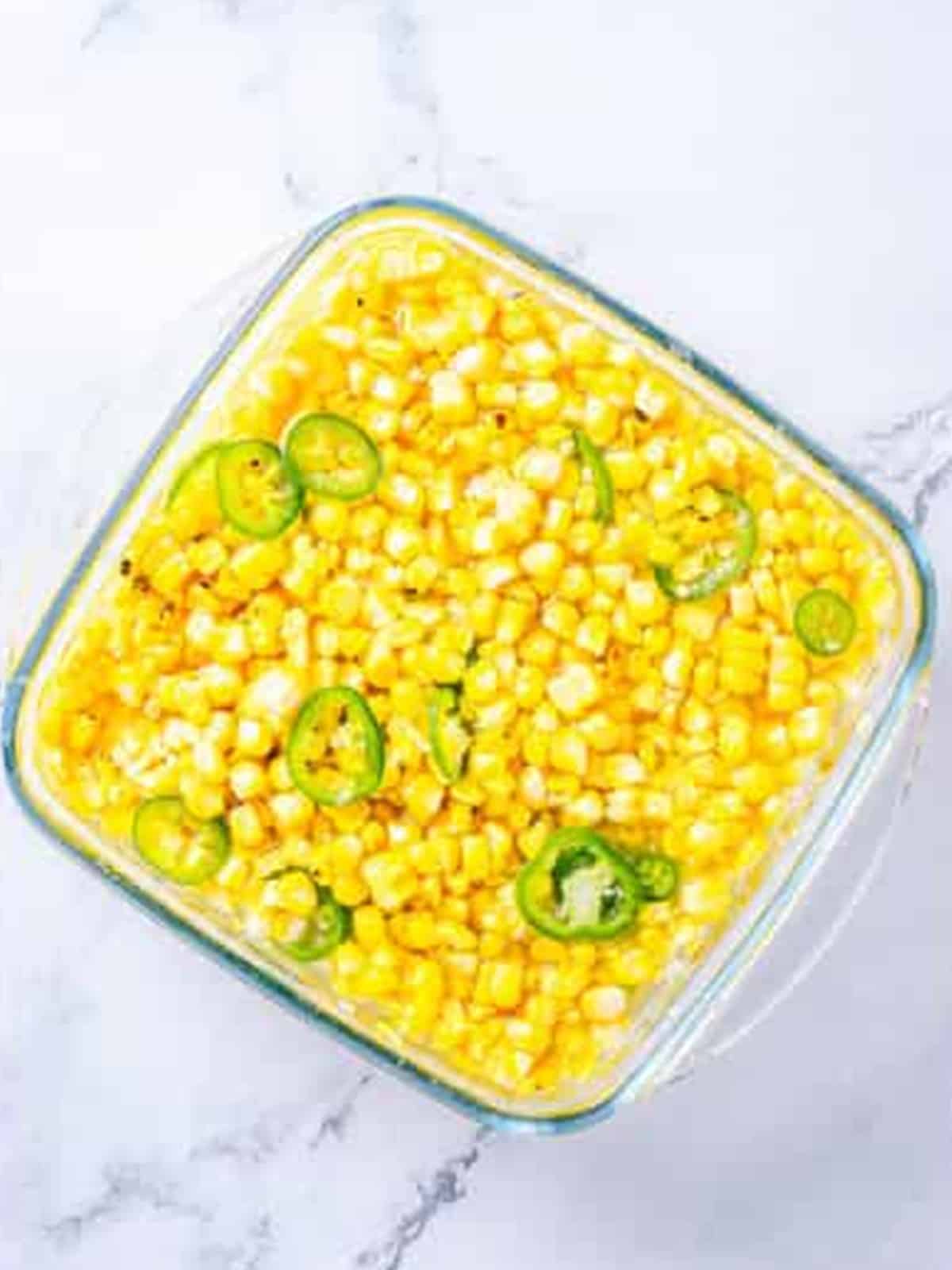 Pouring pickling liquid over the corn for Corn Relish.
