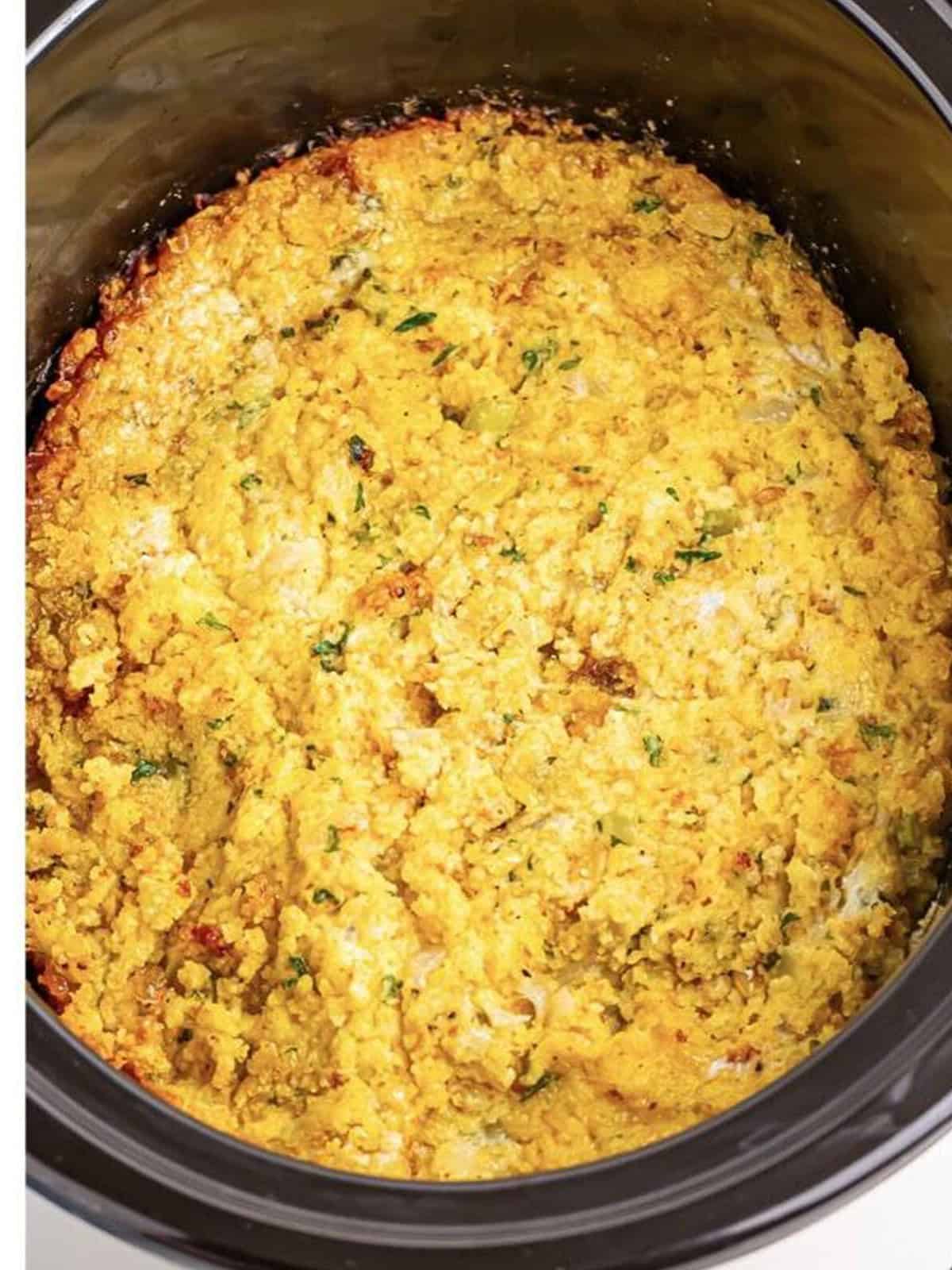Golden cooked slow cooker cornbread dressing ready to serve.
