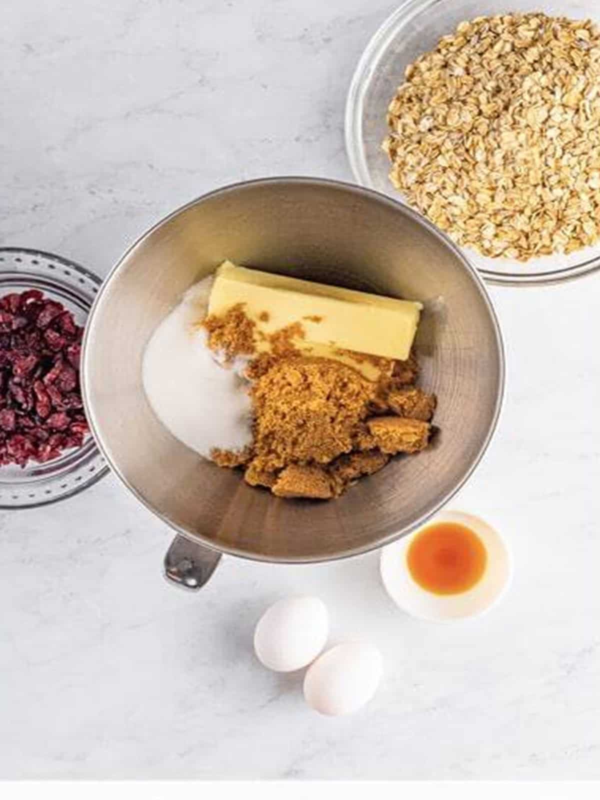 Butter and brown sugar creamed together in a mixing bowl for cranberry oatmeal cookies.