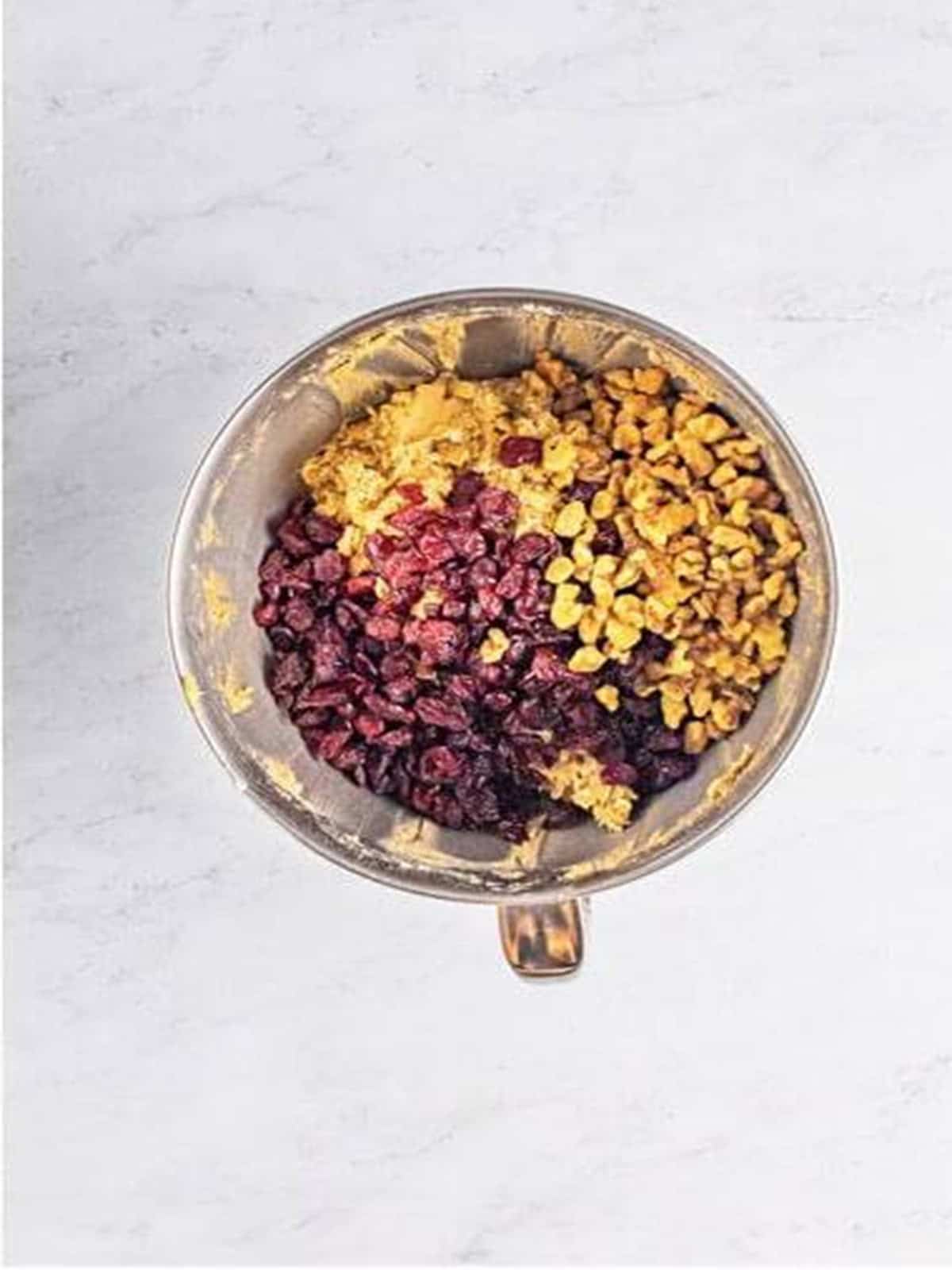 Dried cranberries and chopped walnuts folded into the oatmeal cookie dough.