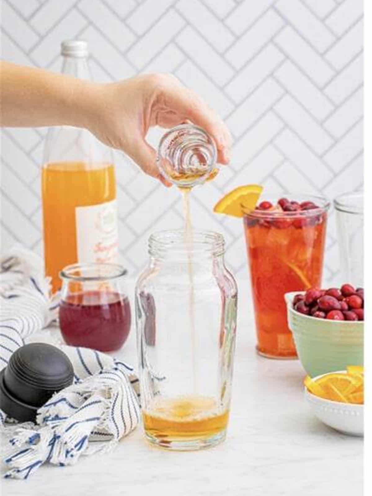 Spiced rum poured into a cocktail shaker.