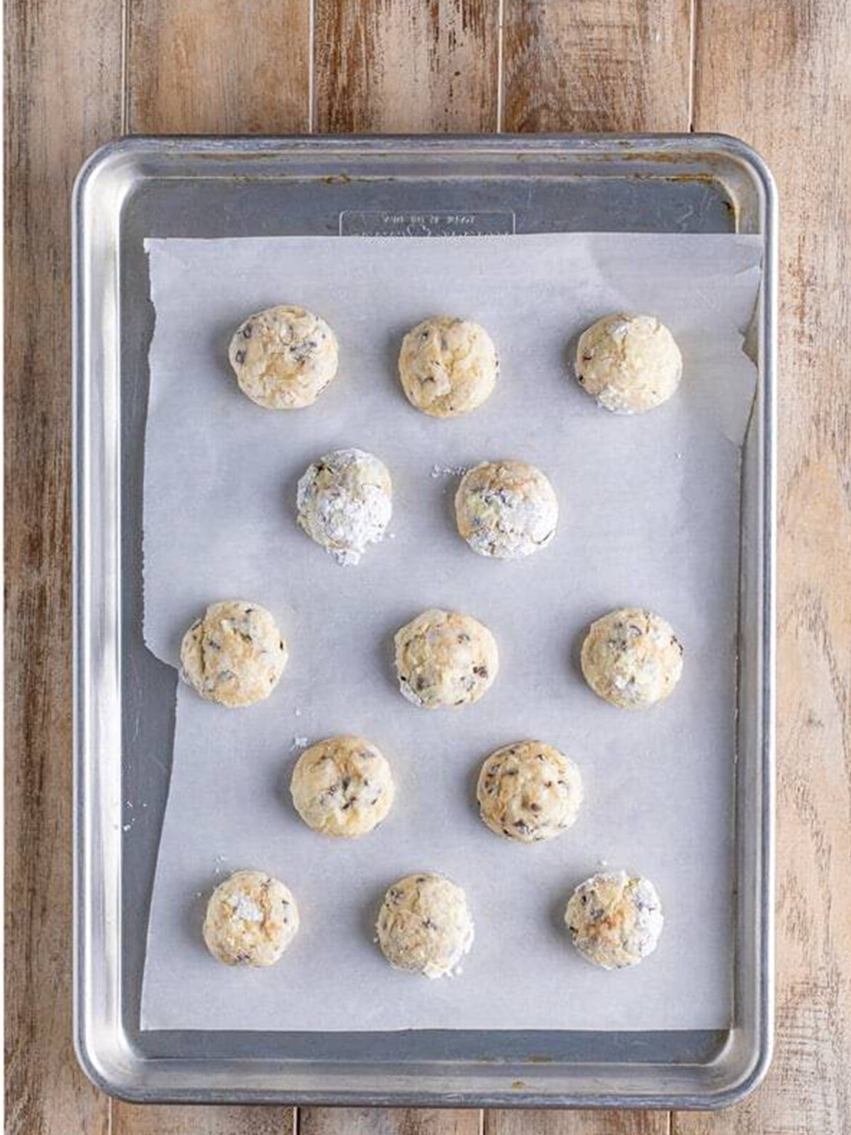 Baked cream cheese chocolate chip cookies on a baking sheet.