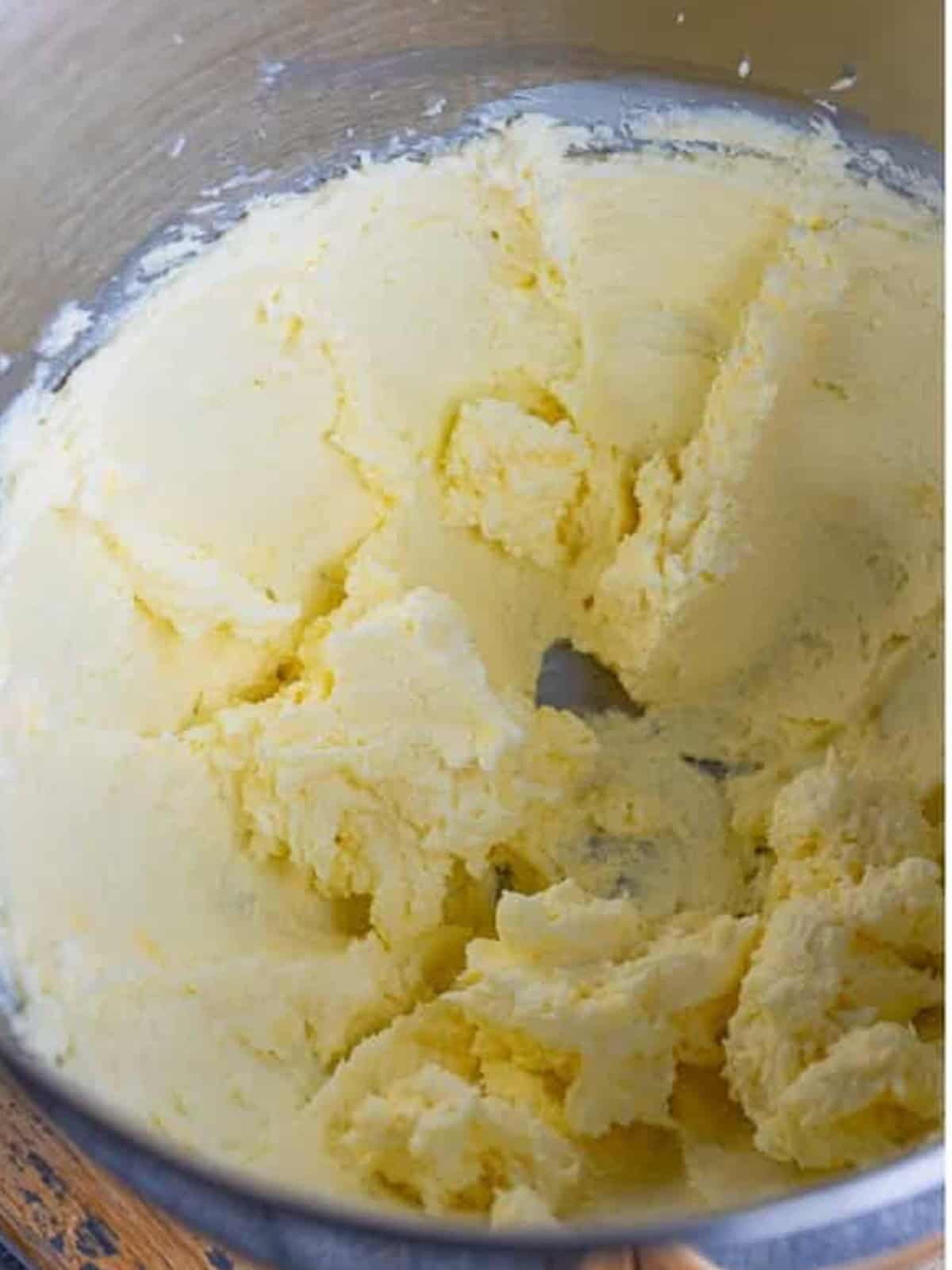 Cream cheese and butter whipped smooth in a stand mixer for cream cheese frosting.