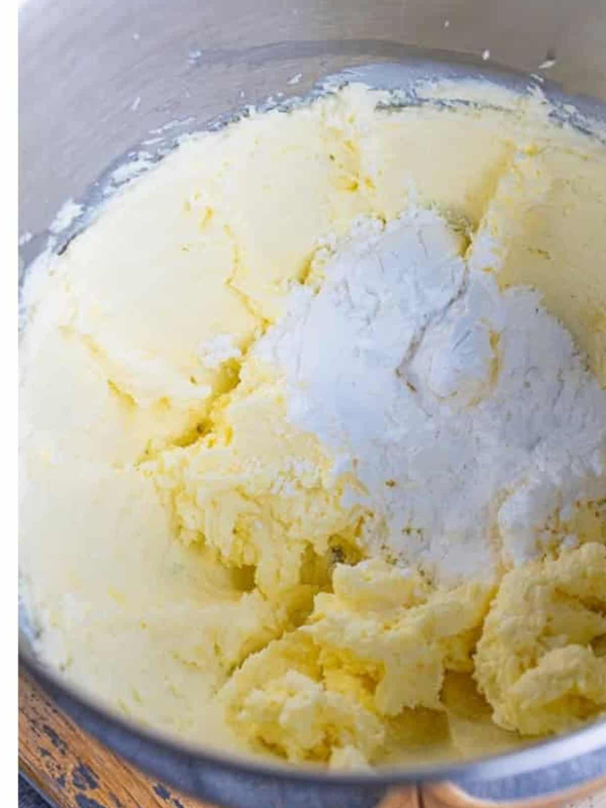 Powdered sugar added to whipped cream cheese and butter.