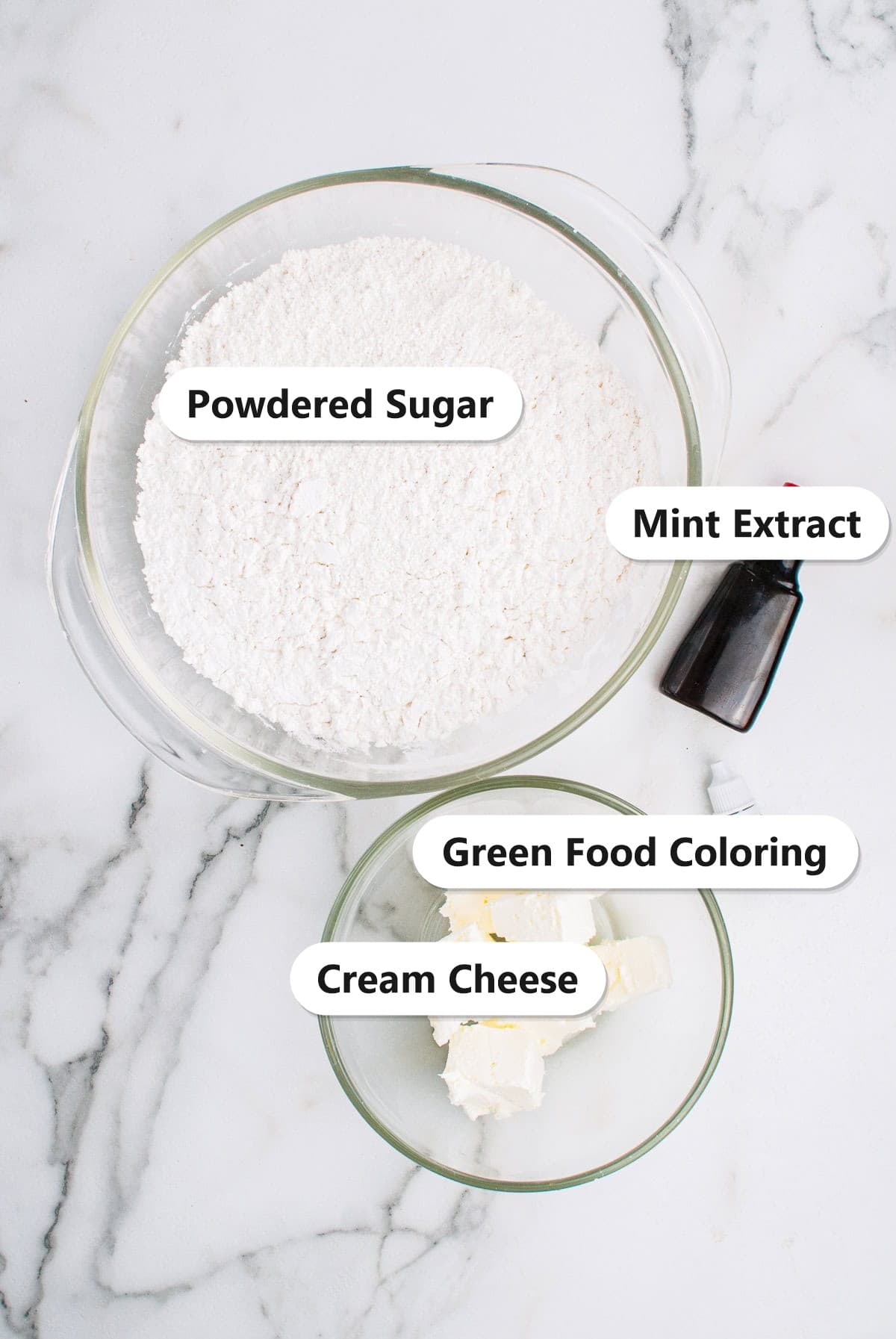 Ingredients for cream cheese mints including powdered sugar, cream cheese, mint extract, and green food coloring.