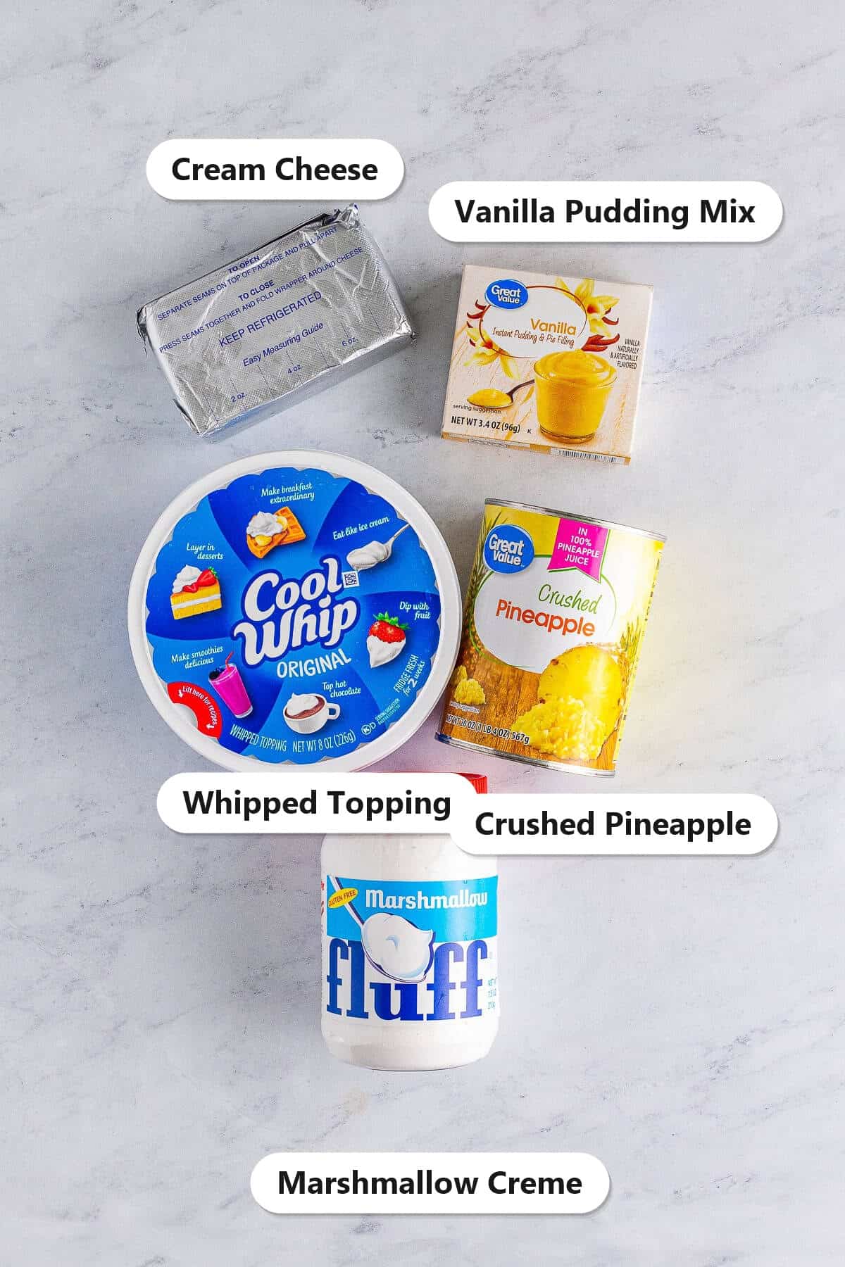 Labeled ingredients for cream cheese pineapple dip including cream cheese, vanilla pudding mix, whipped topping, crushed pineapple, and marshmallow creme.