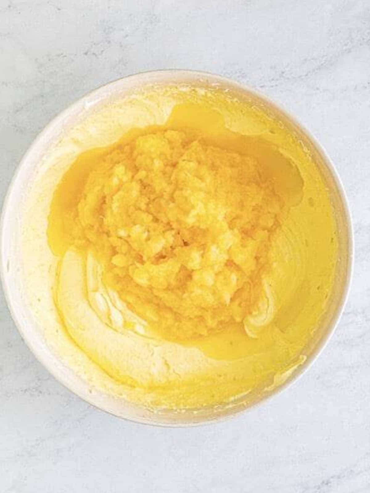 Crushed pineapple folded into the fluffy cream cheese dip mixture.