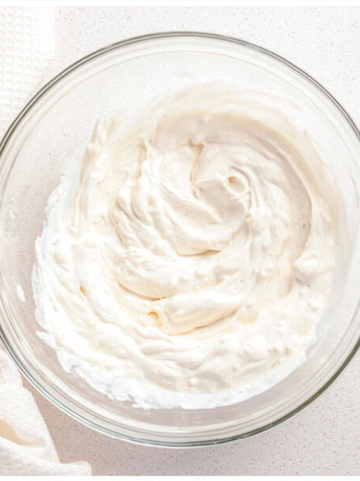 Cream cheese, sour cream, and ranch seasoning beaten smooth in a bowl.