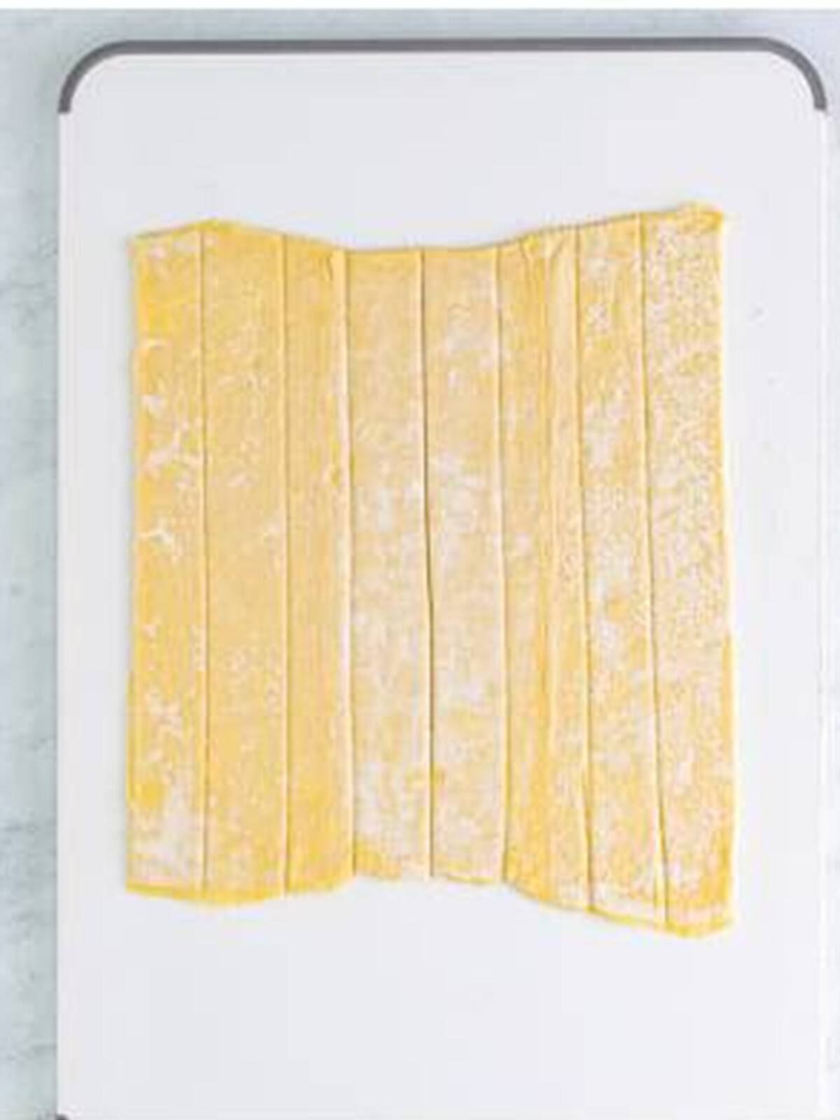 Puff pastry sheet cut into one inch strips for cream horns.
