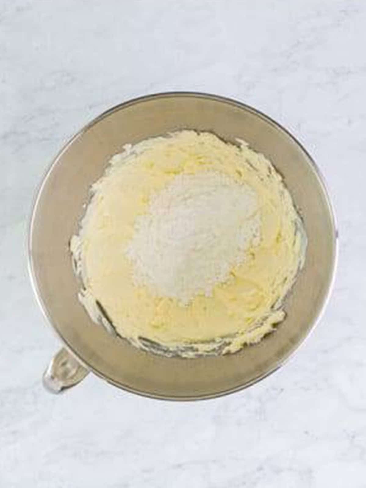 Powdered sugar added to the whipped cream cheese for cream horns filling.