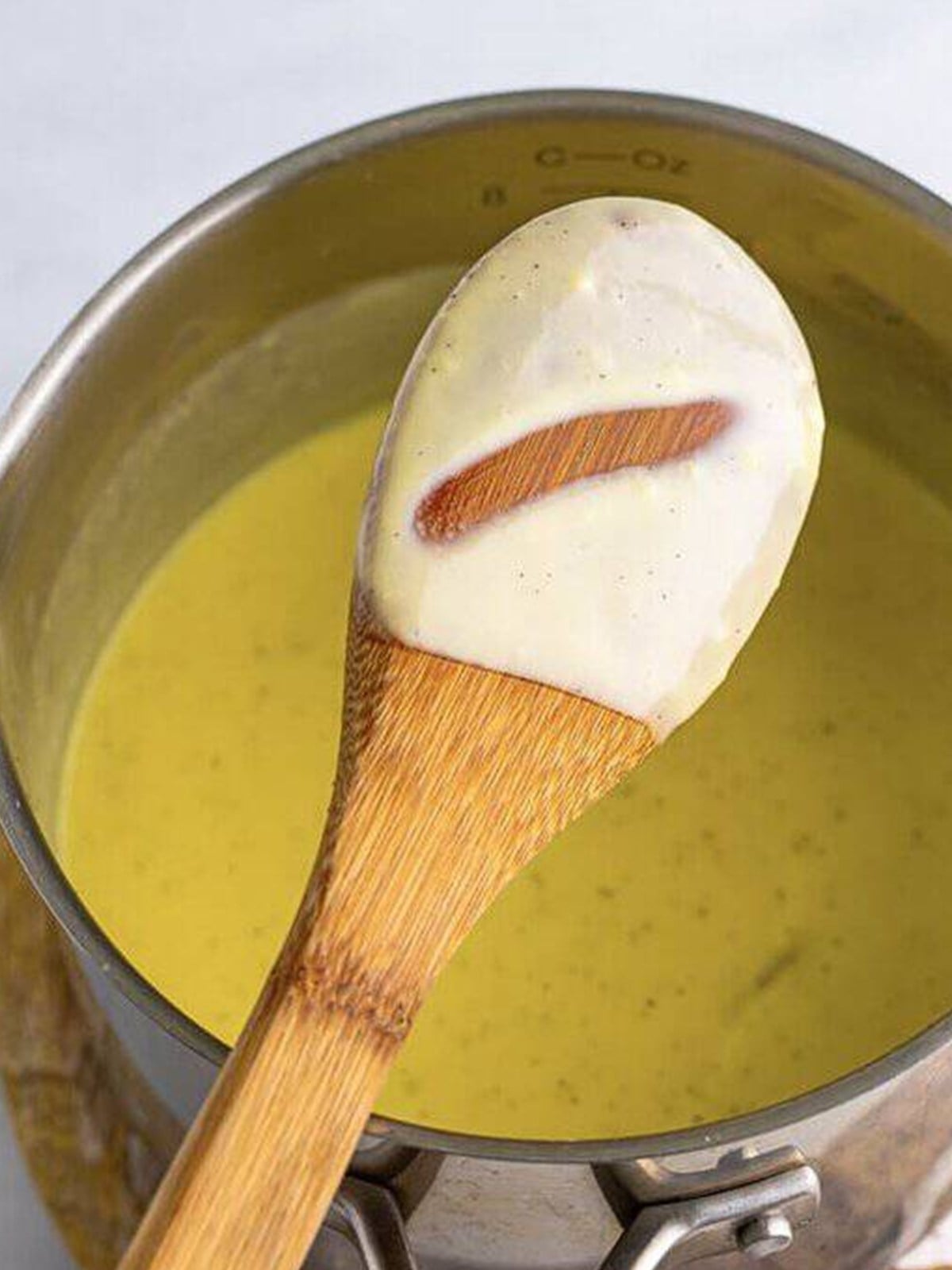 Creme anglaise cooked until it coats the back of a wooden spoon.