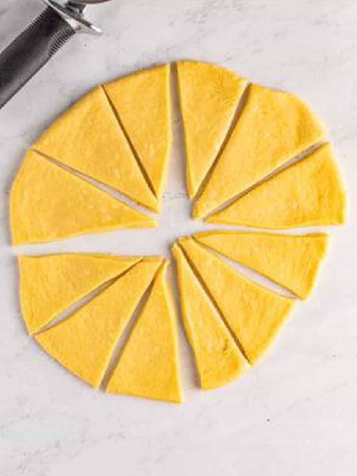 Crescent roll dough rolled into a circle and cut into 12 even wedges with a pizza cutter.
