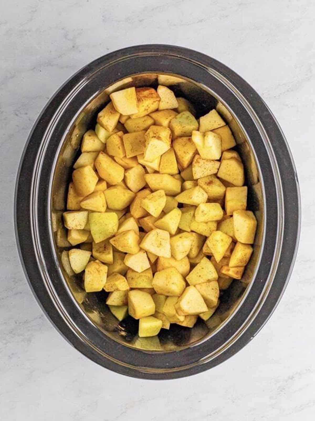 Water, lemon juice, and cinnamon stirred into the apples.