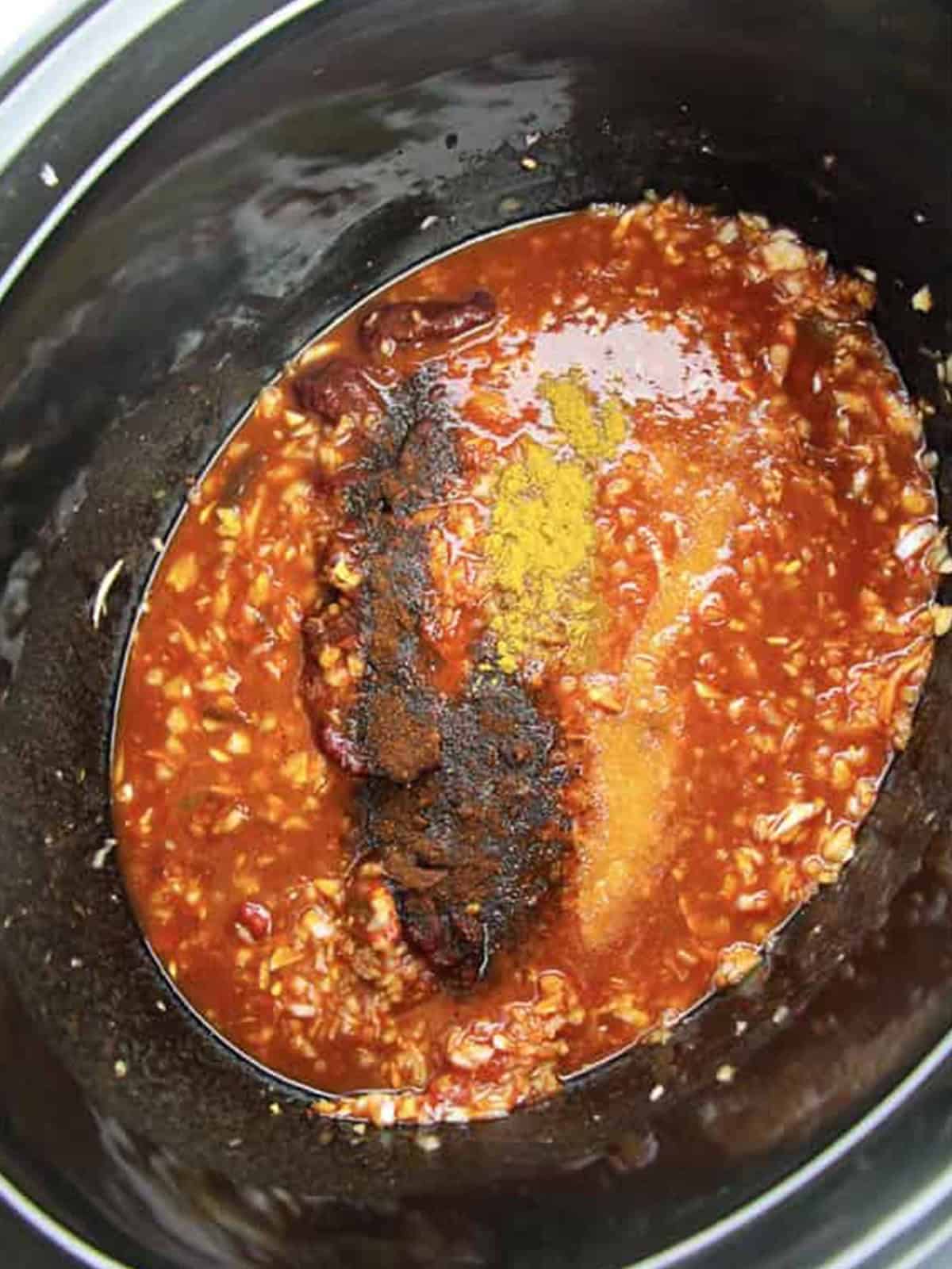 Chipotle sauce whisked together in a crockpot.