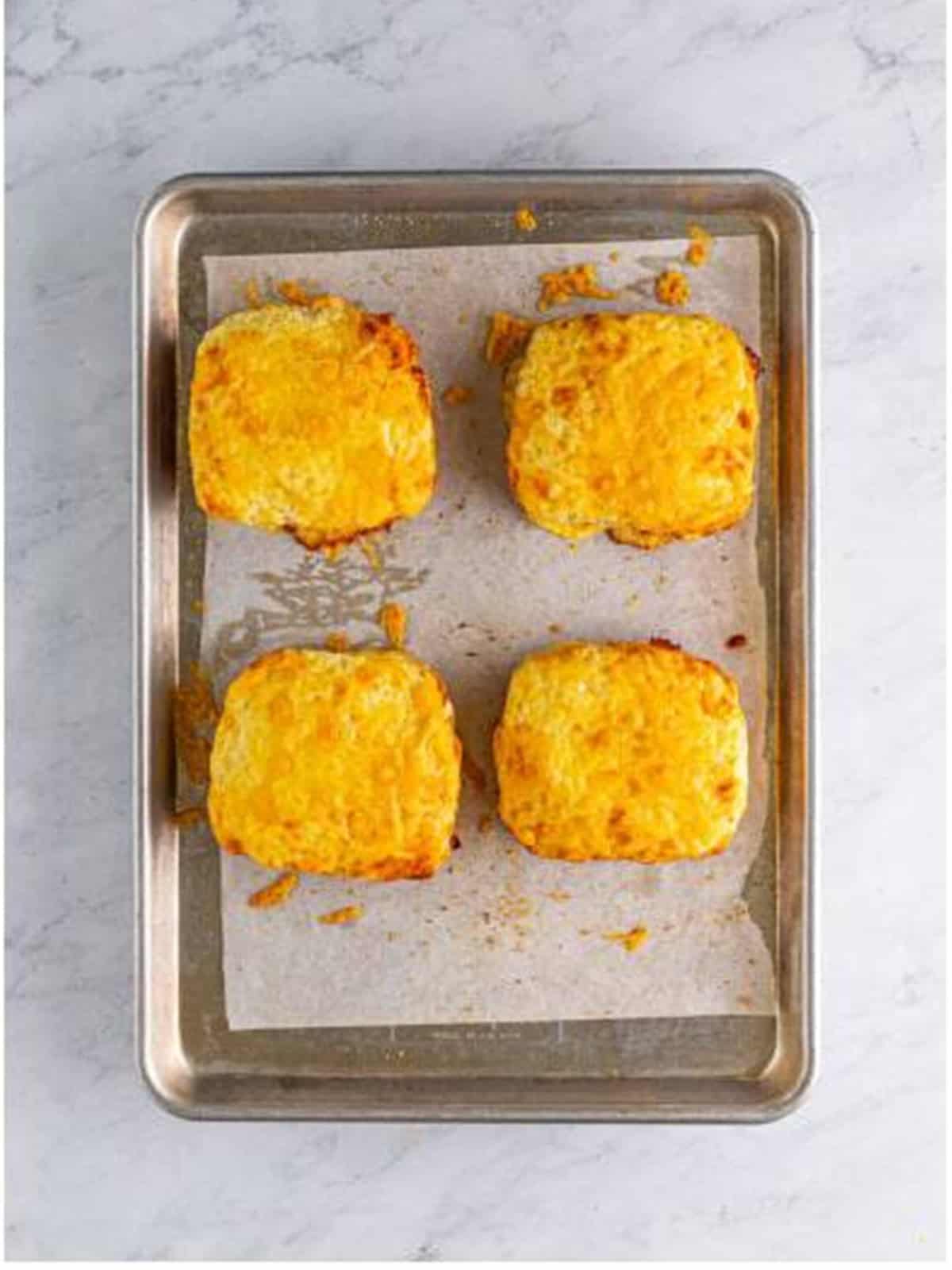 Golden, bubbly baked croque monsieur sandwiches fresh from the oven.