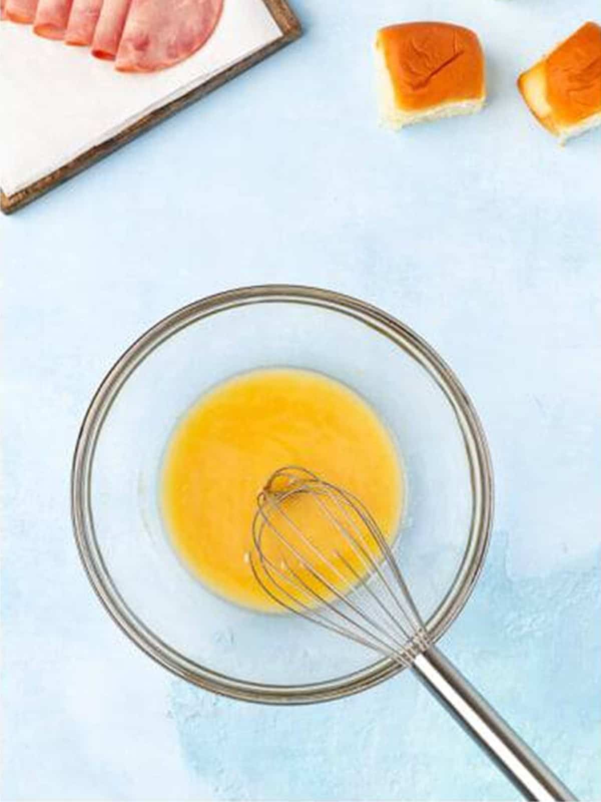 Butter, mustard, Worcestershire, and garlic powder whisked for the Cuban sliders topping.