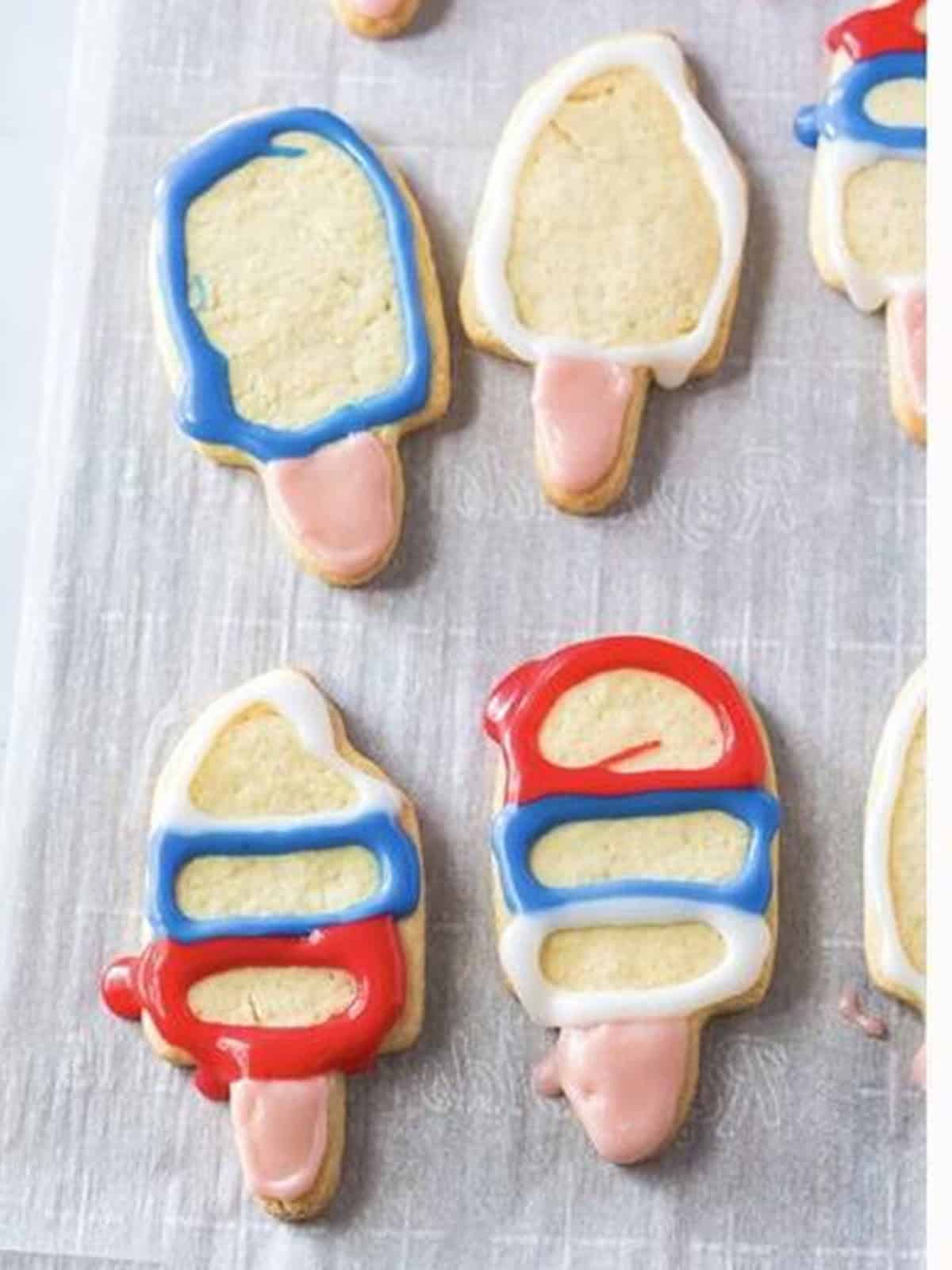 Popsicle sugar cookies decorated with red, white, and blue icing.