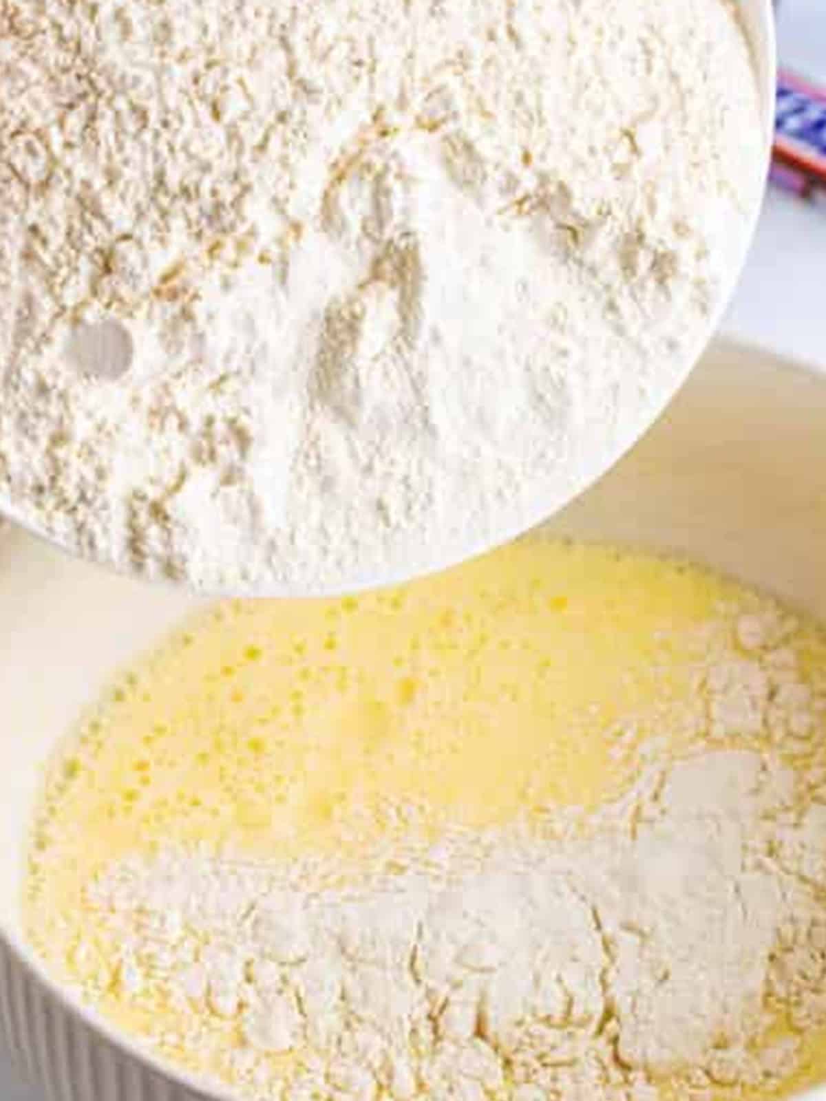 Flour, baking powder, and salt added to the wet batter ingredients.