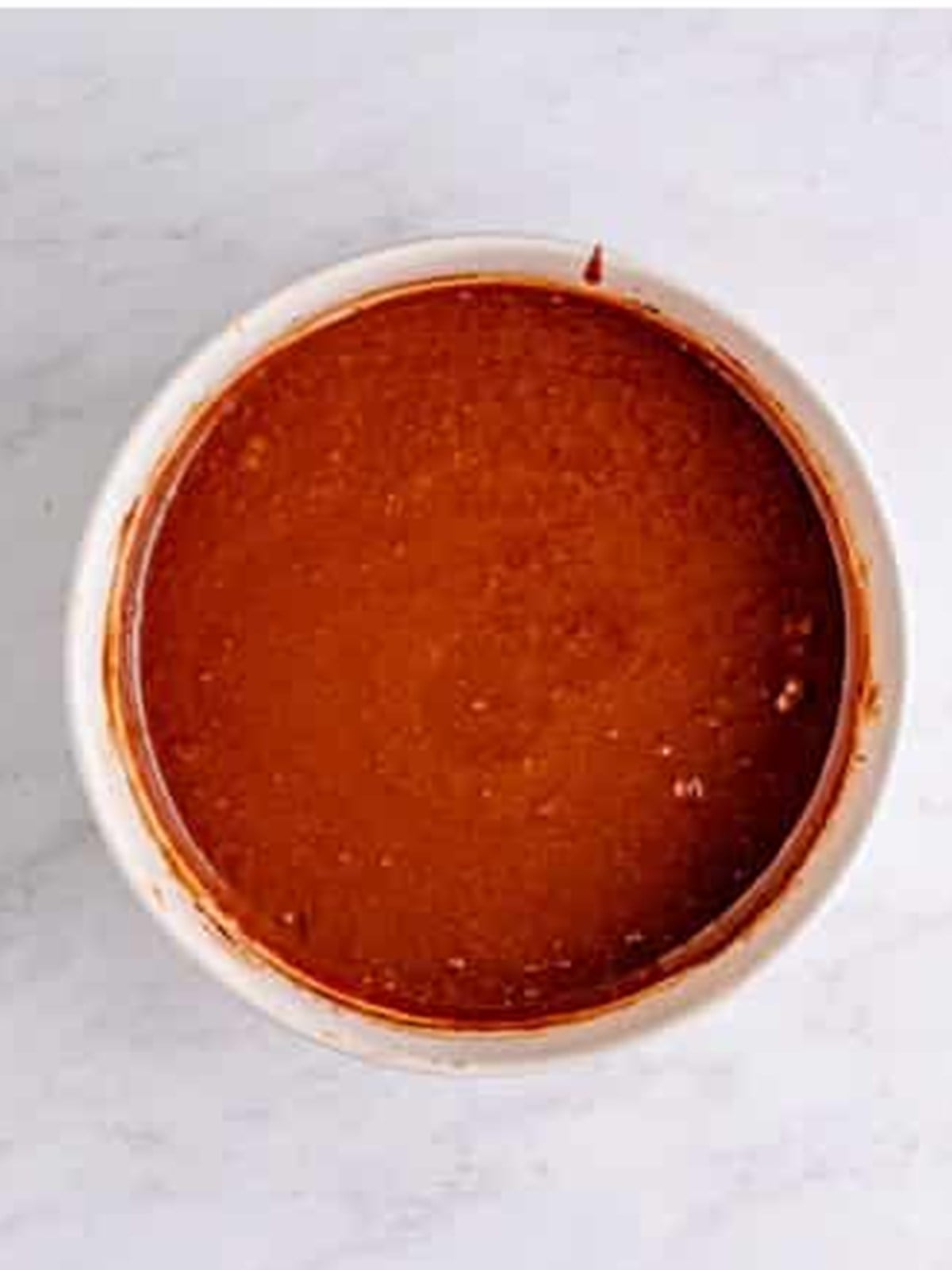 Chocolate cake batter mixed in a bowl for ding dong cake.